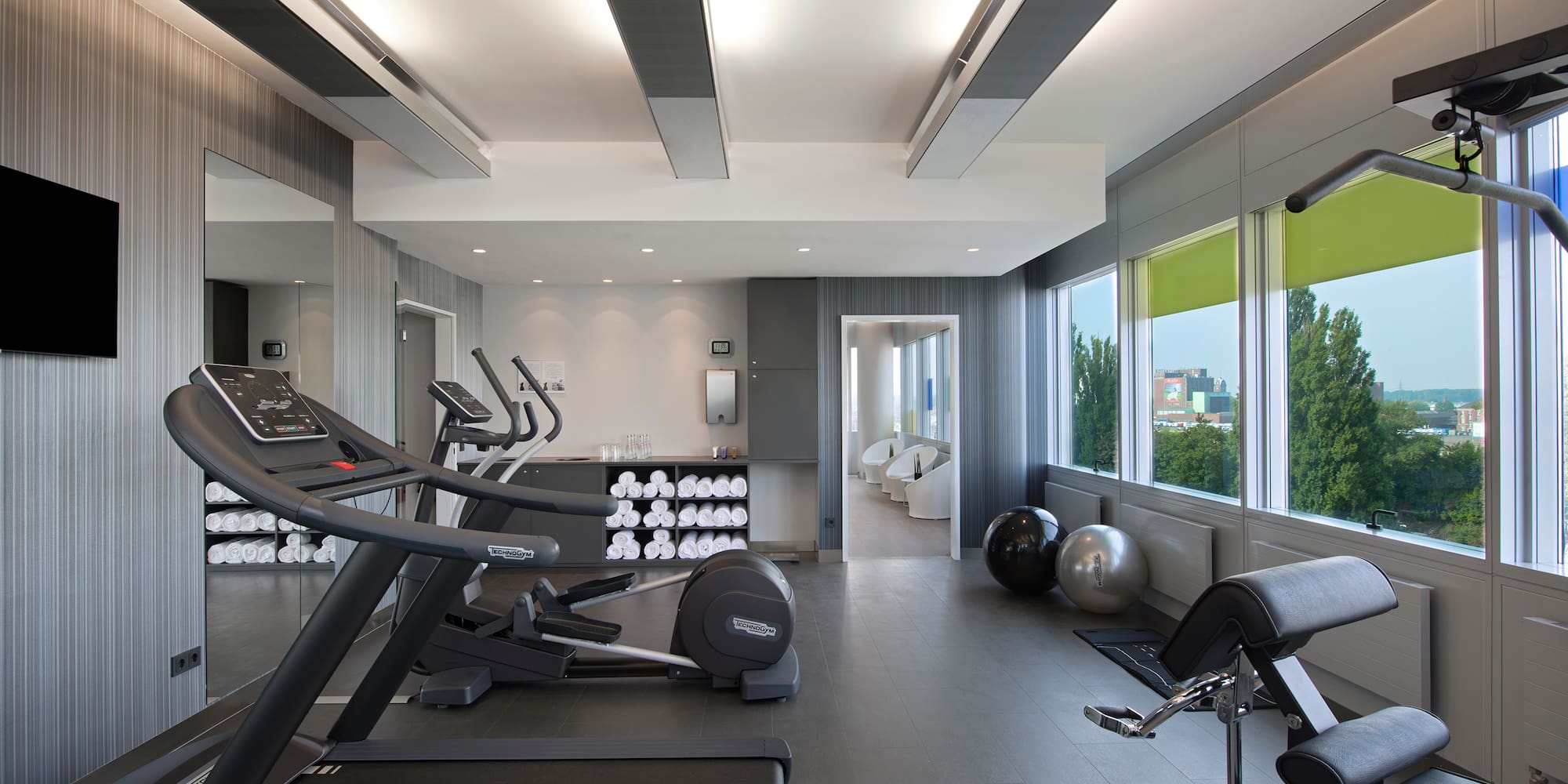 a room with treadmills and exercise equipment