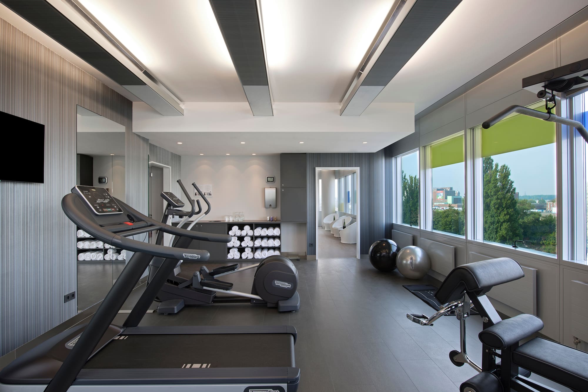 a room with treadmills and exercise equipment