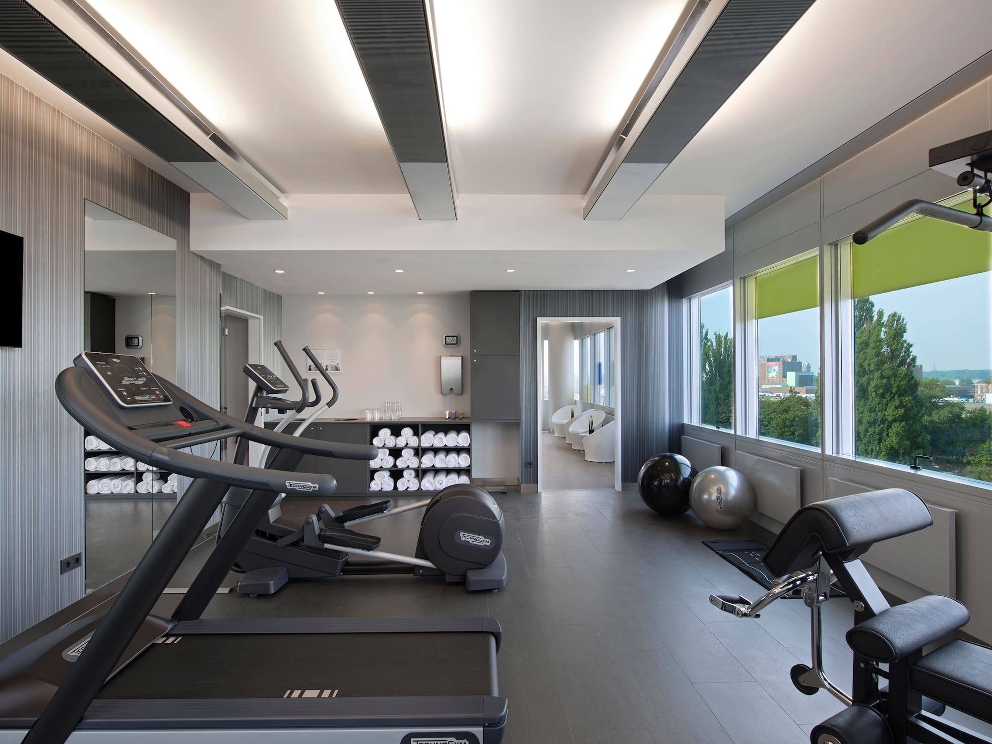 a room with treadmills and exercise equipment