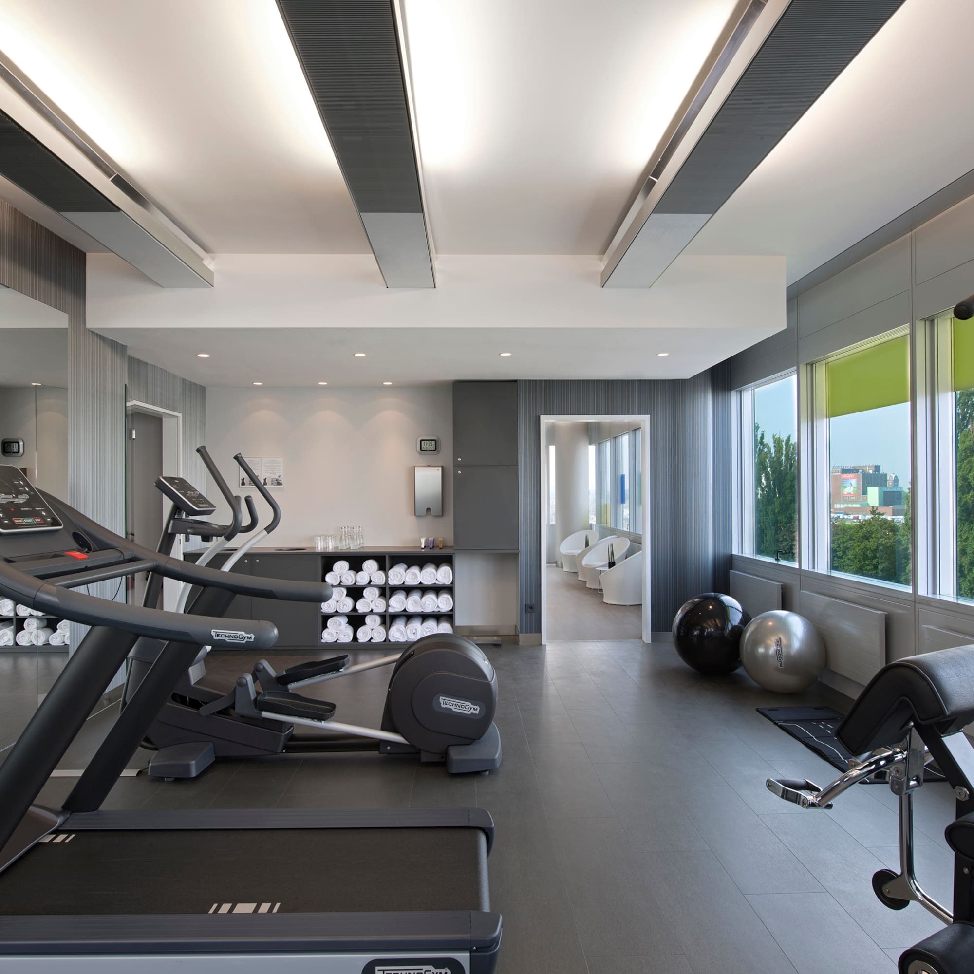 a room with treadmills and exercise equipment