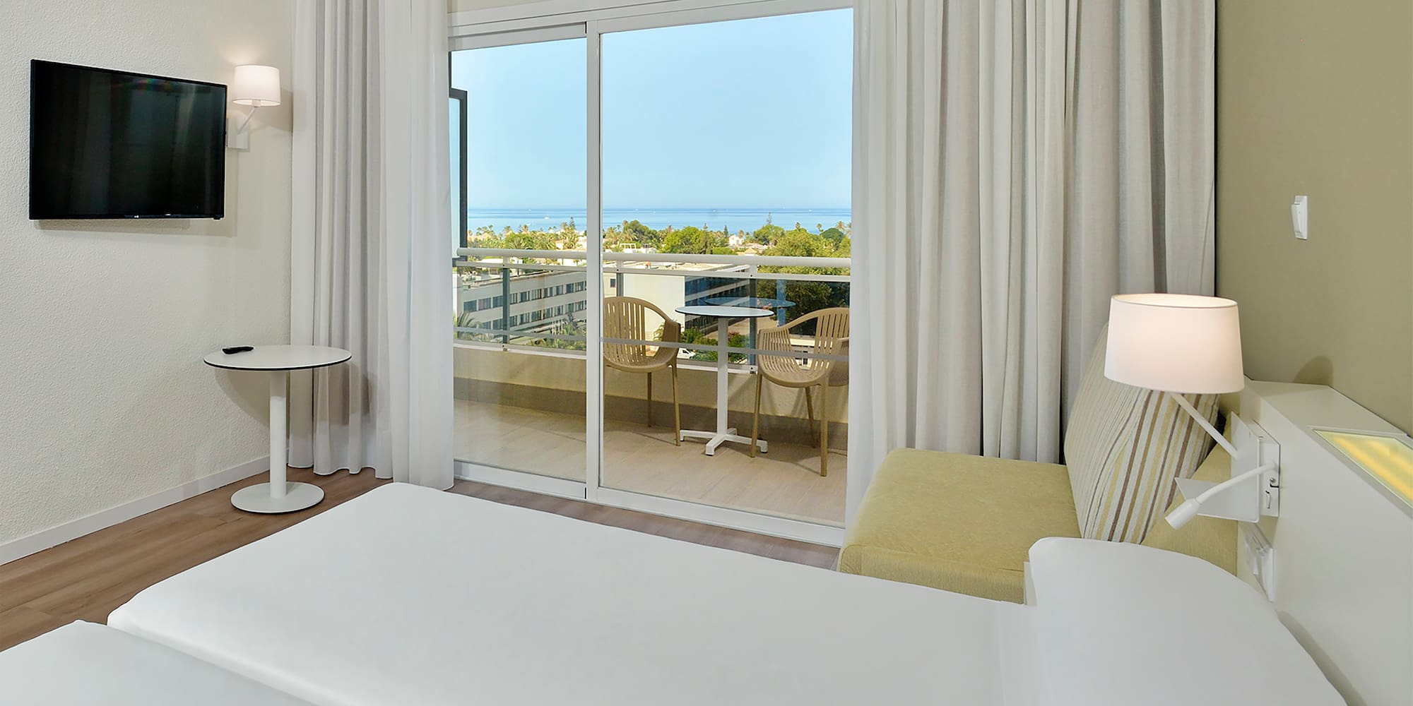a bedroom with a sliding glass door