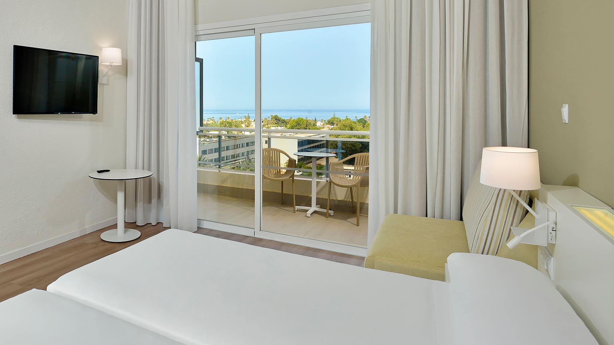 a bedroom with a sliding glass door