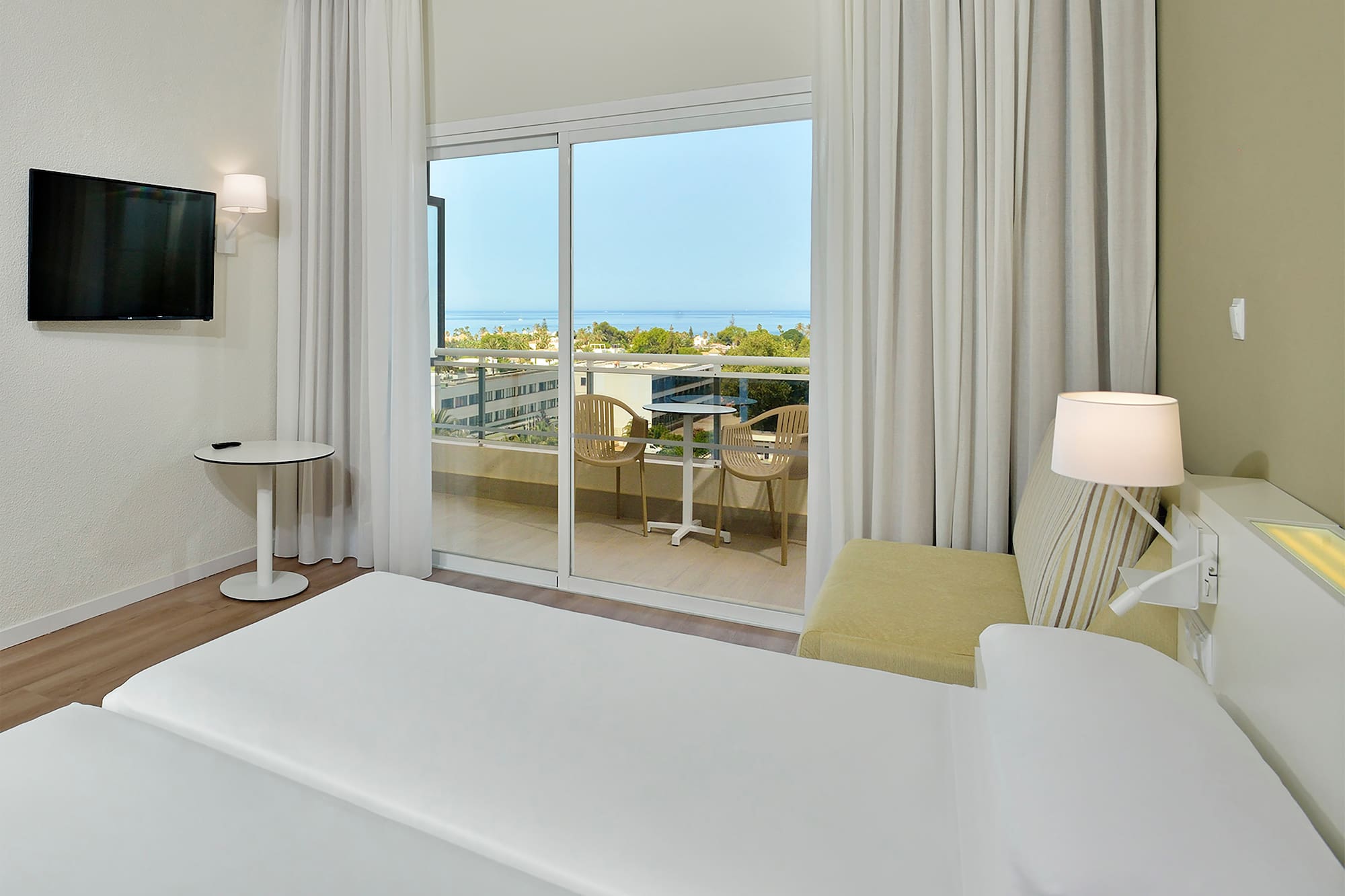 a bedroom with a sliding glass door