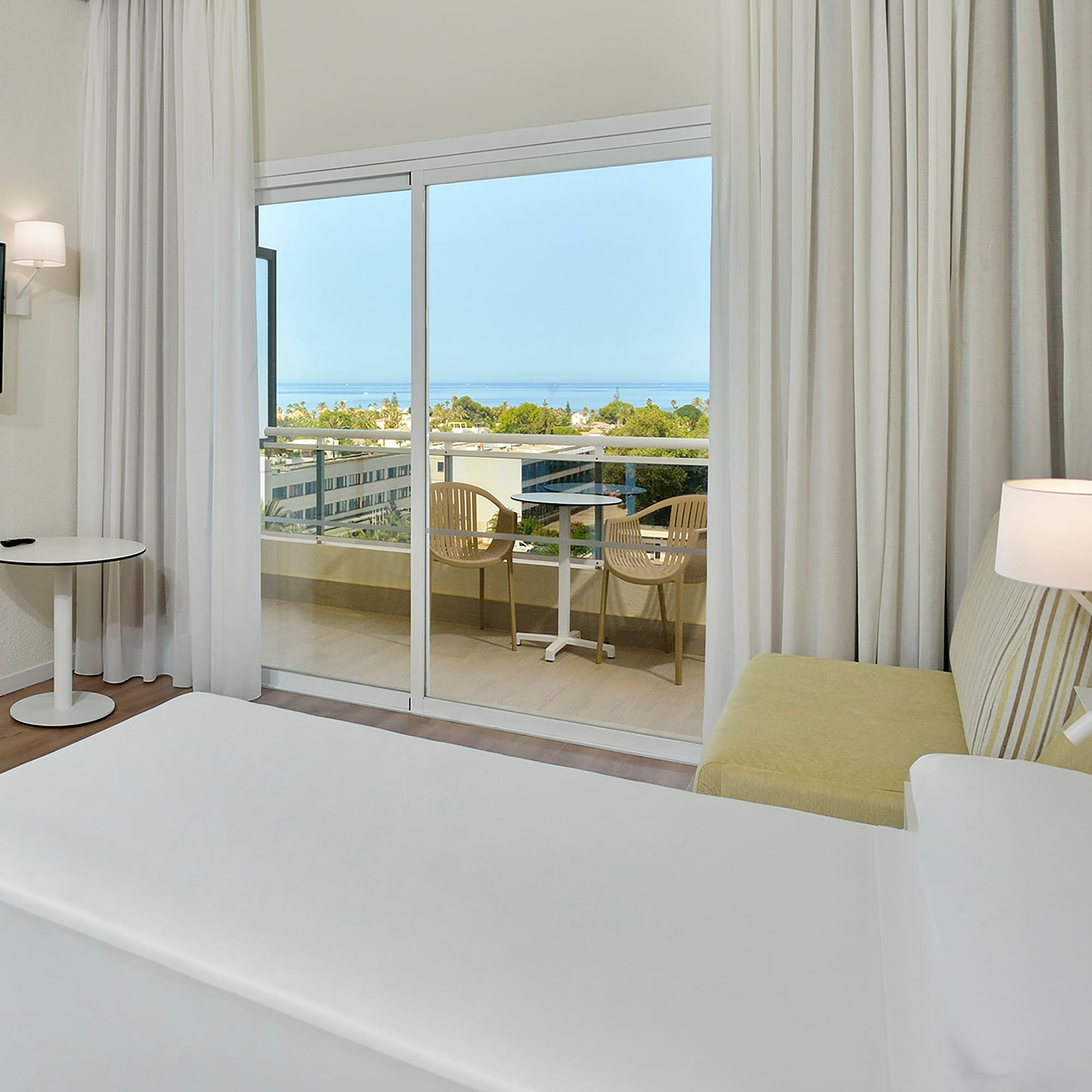 a bedroom with a sliding glass door