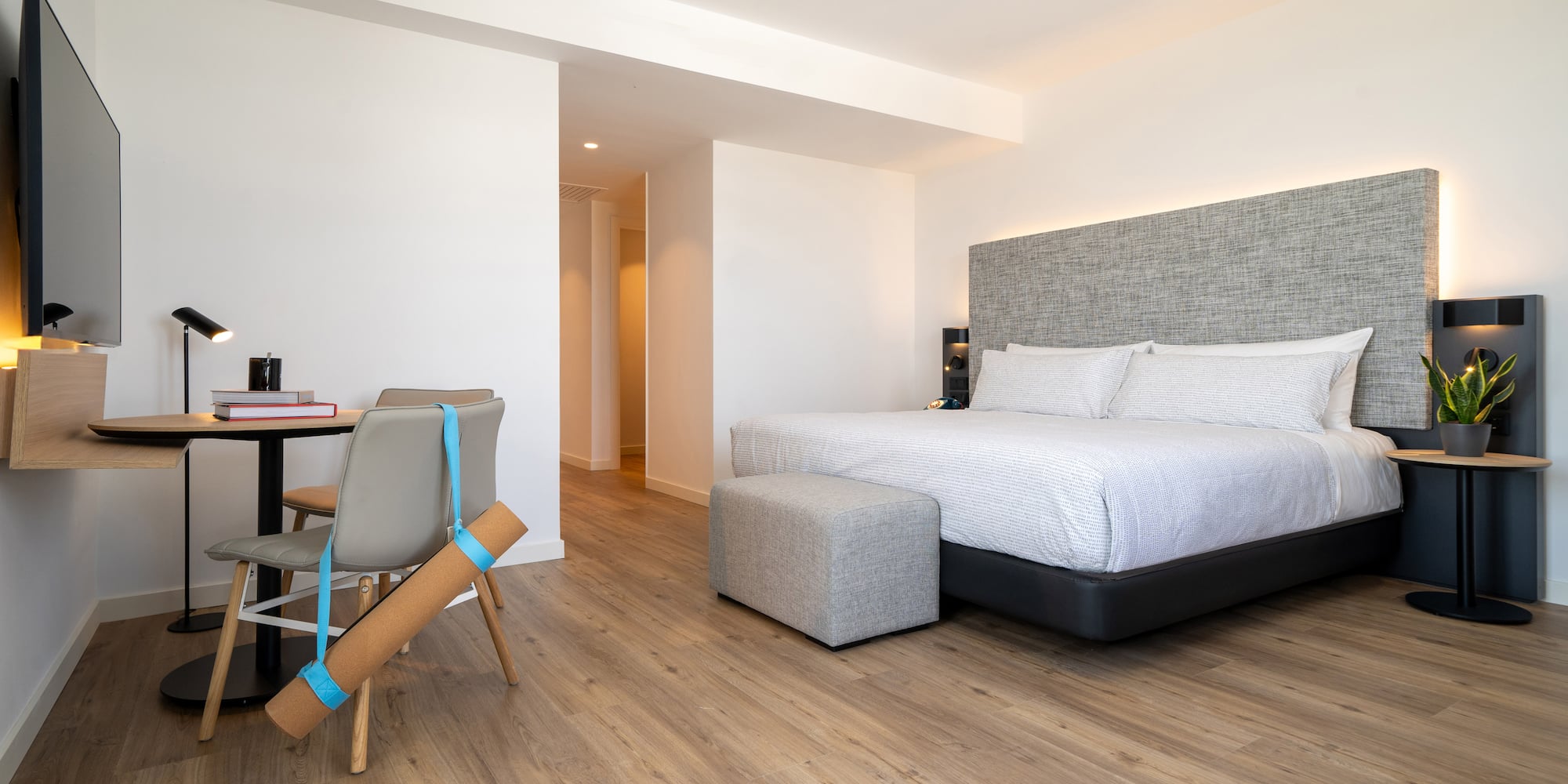 a bedroom with a bed and a desk