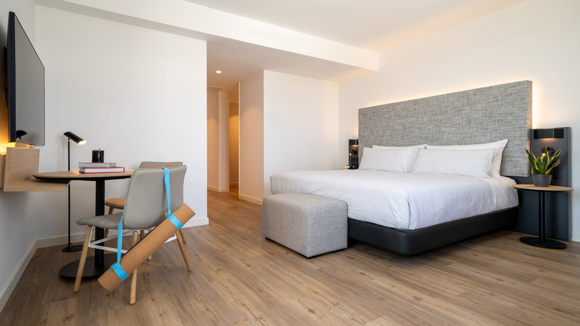 a bedroom with a bed and a desk