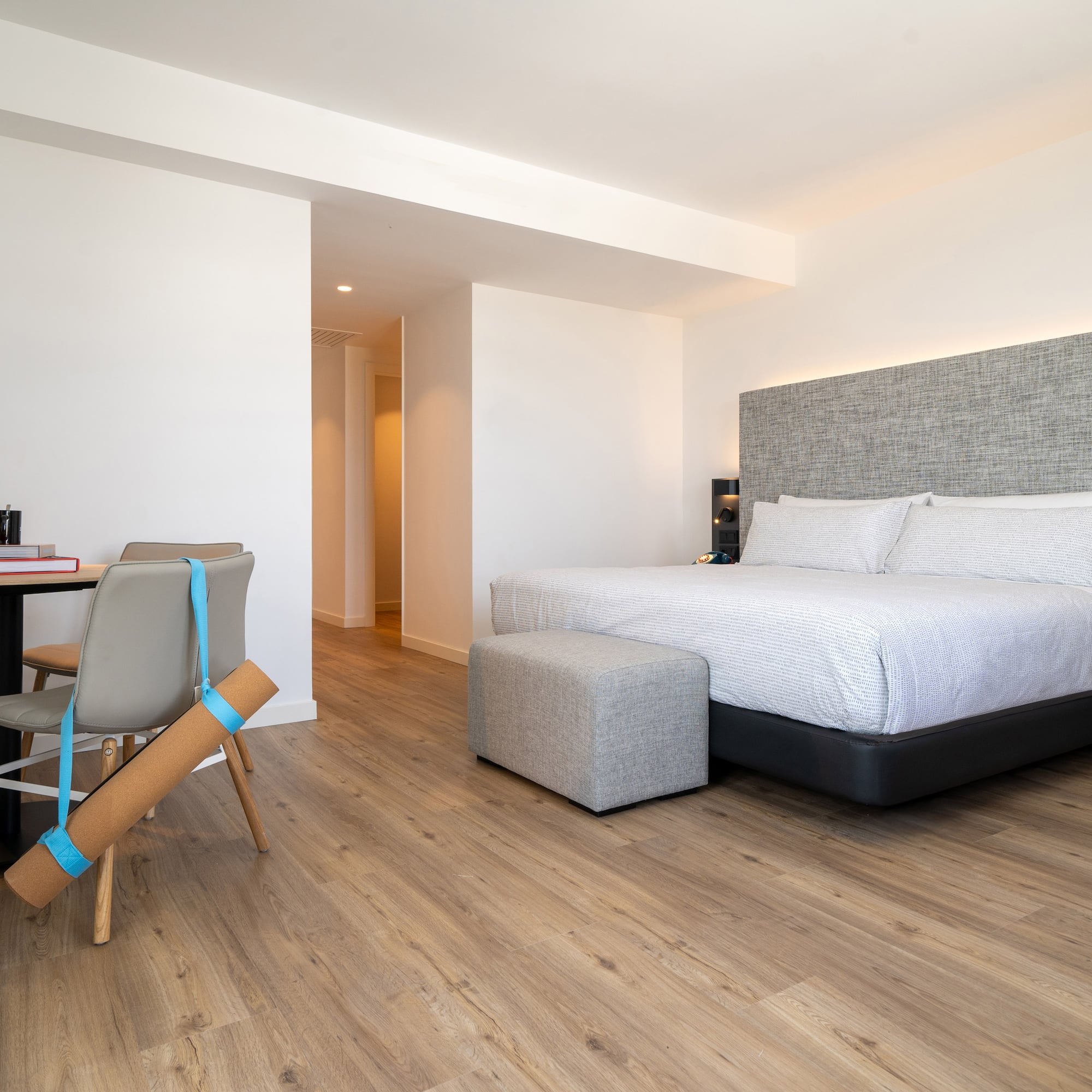 a bedroom with a bed and a desk