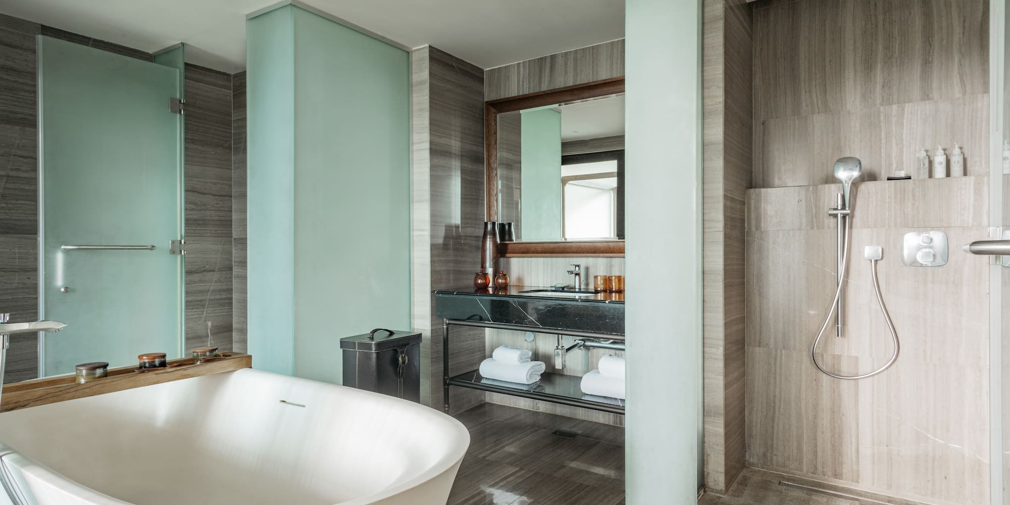 a bathroom with a tub and shower