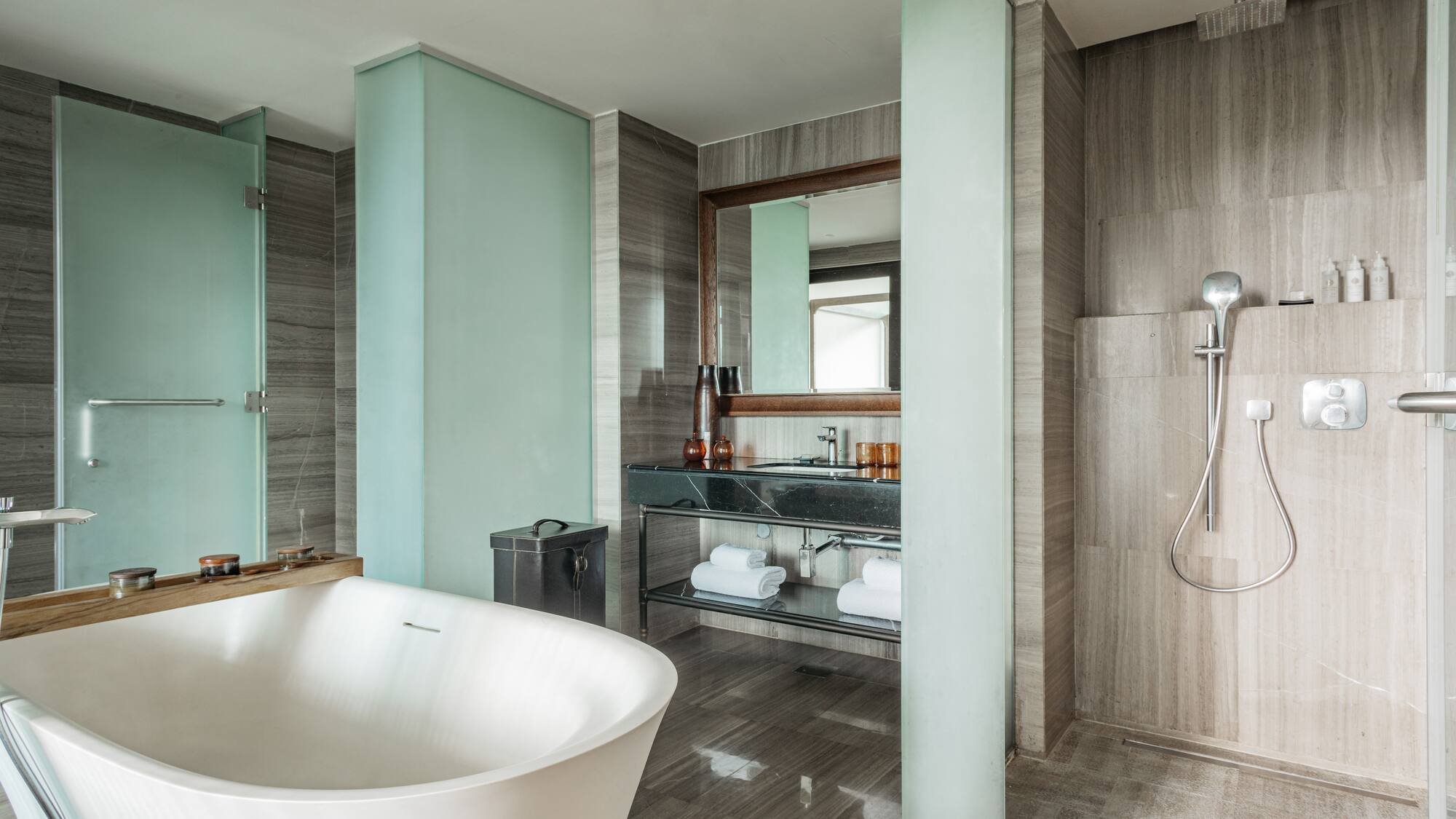 a bathroom with a tub and shower