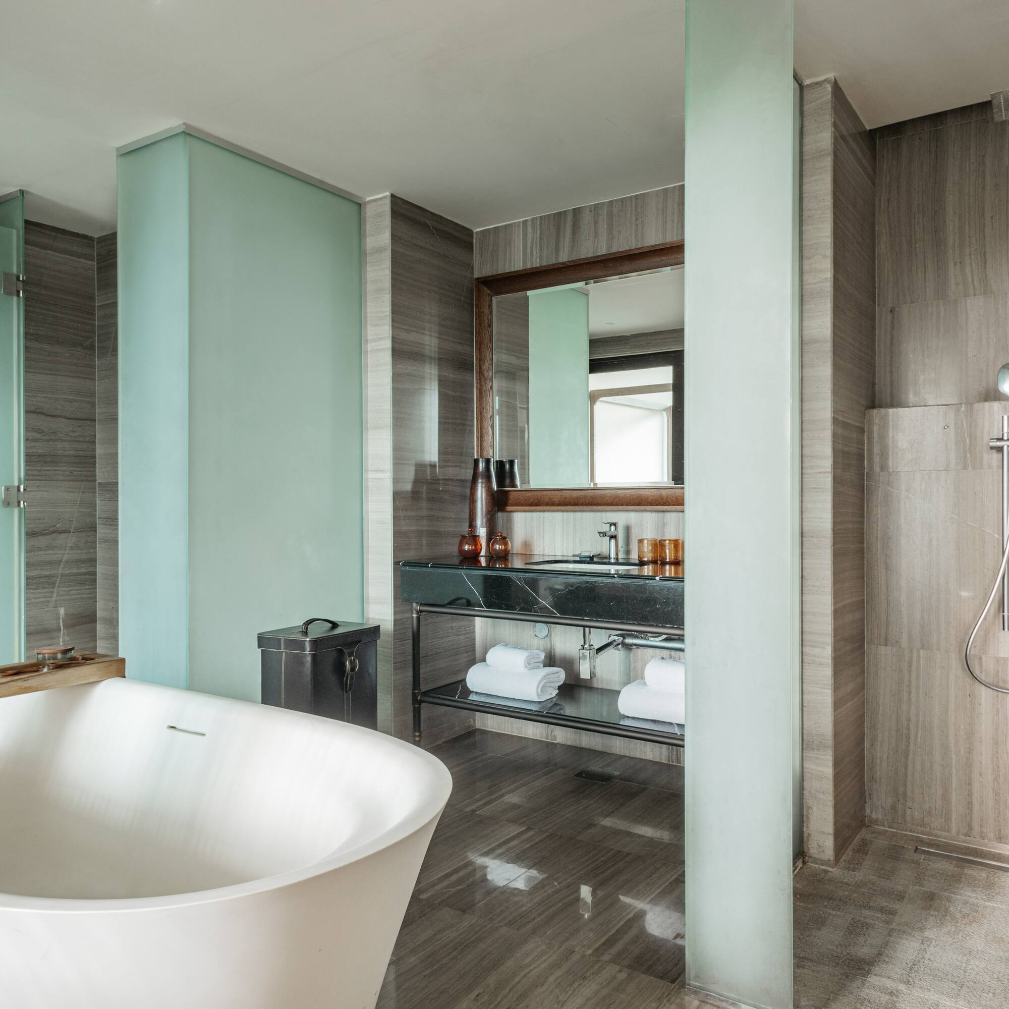 a bathroom with a tub and shower