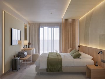 a bedroom with a bed and a mirror