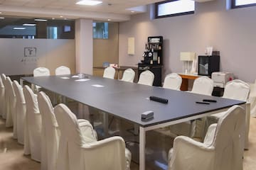 a conference room with a table and chairs