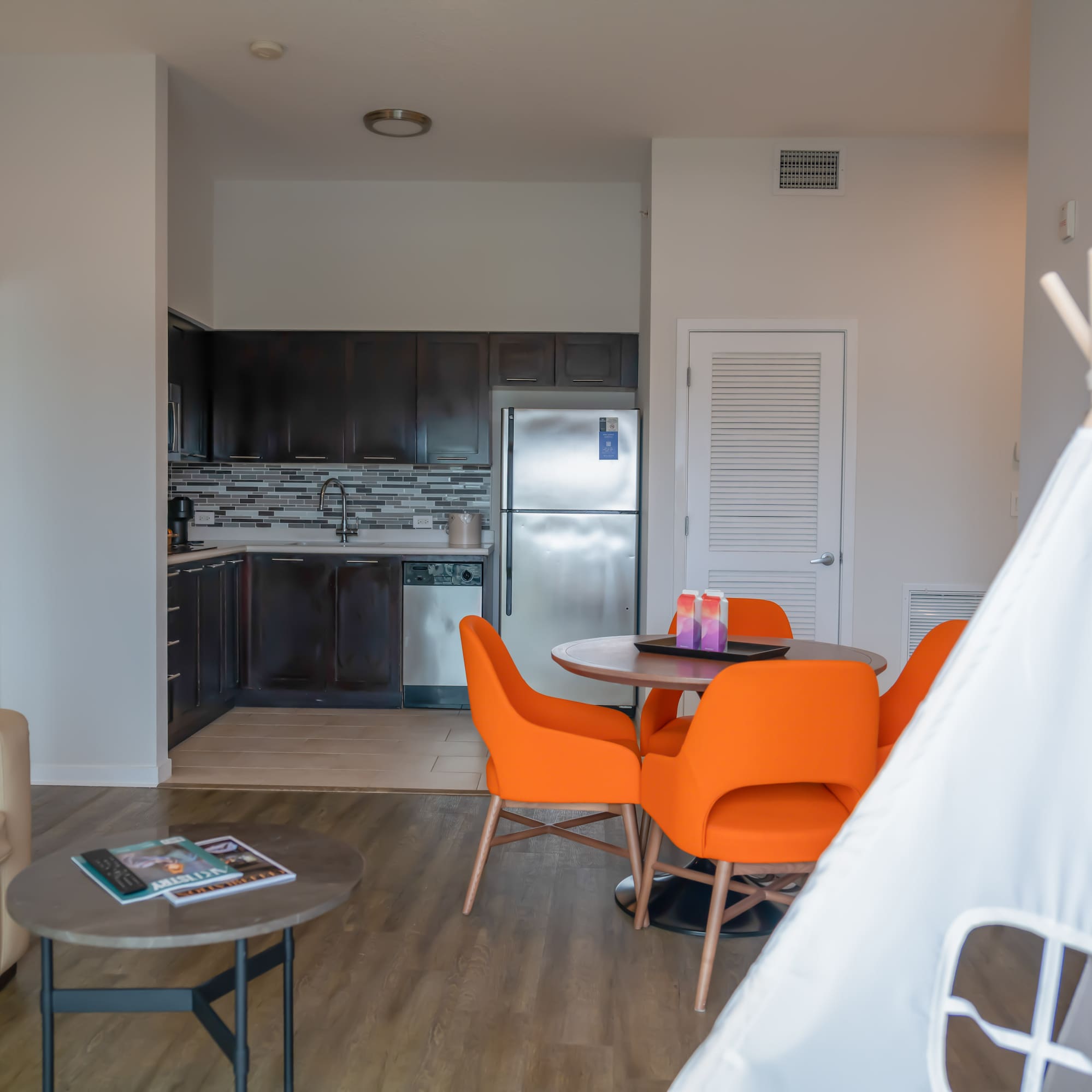 a room with a table and chairs