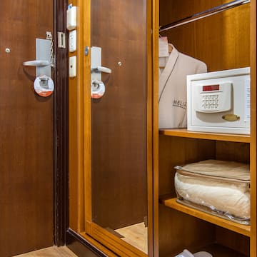 a closet with a door and a safe