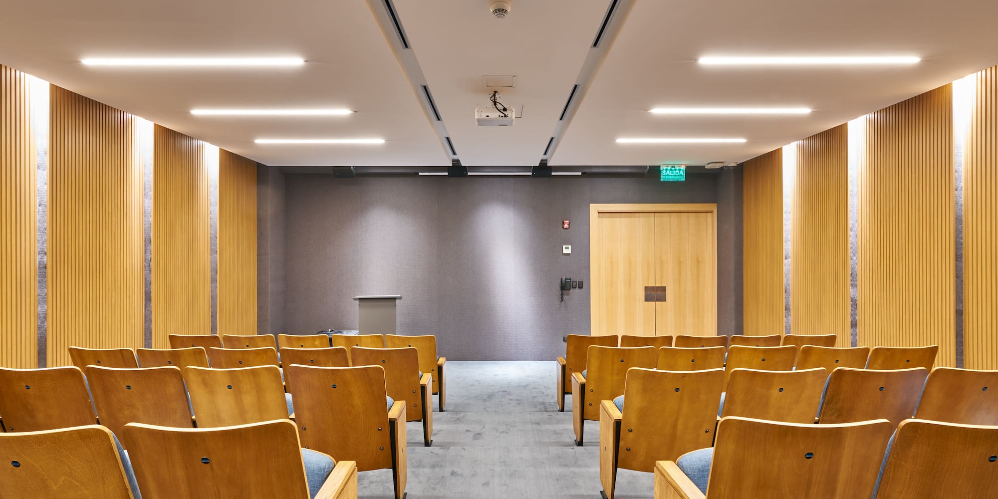 a room with chairs and a podium