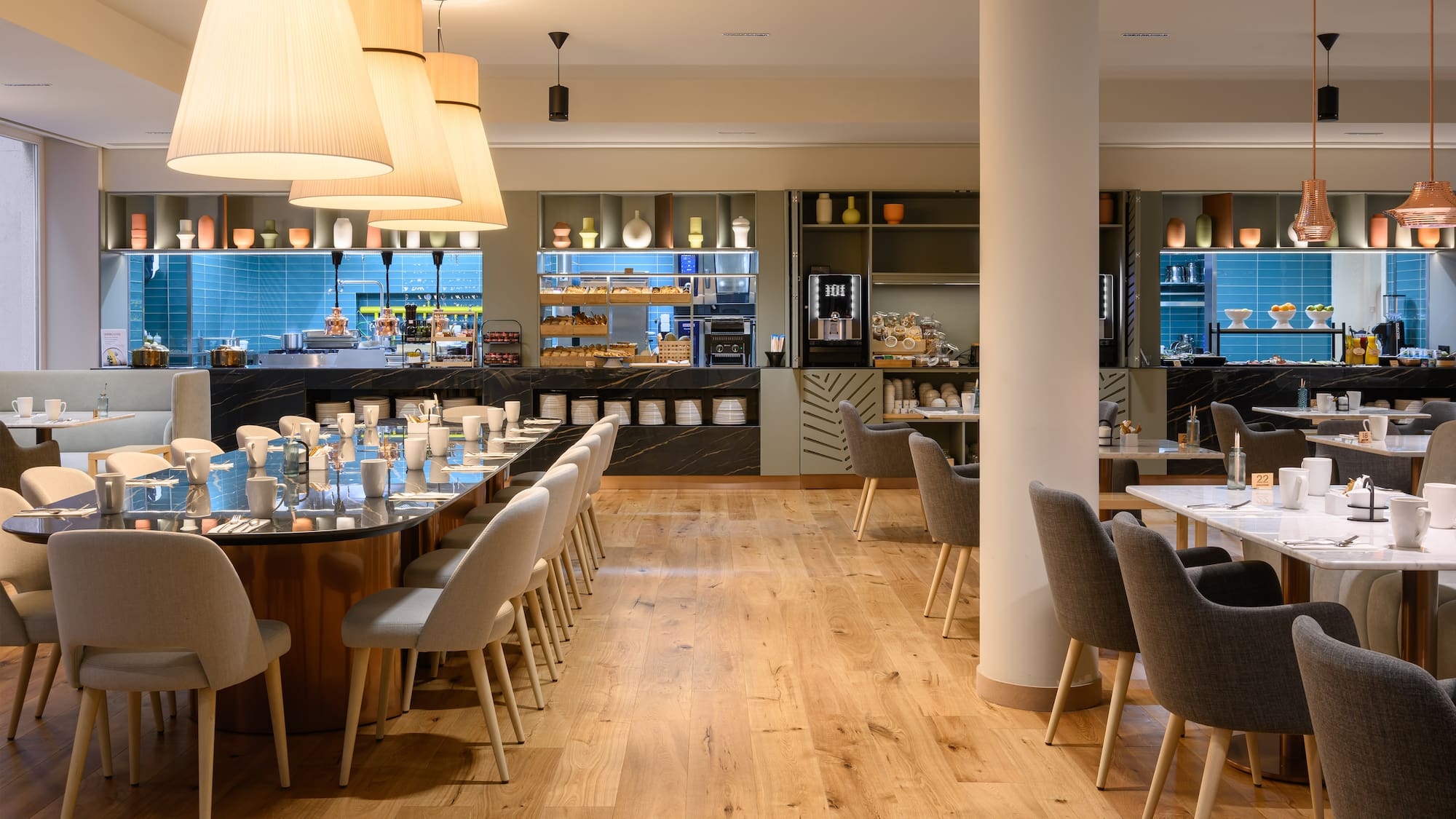 a restaurant with a large table and chairs