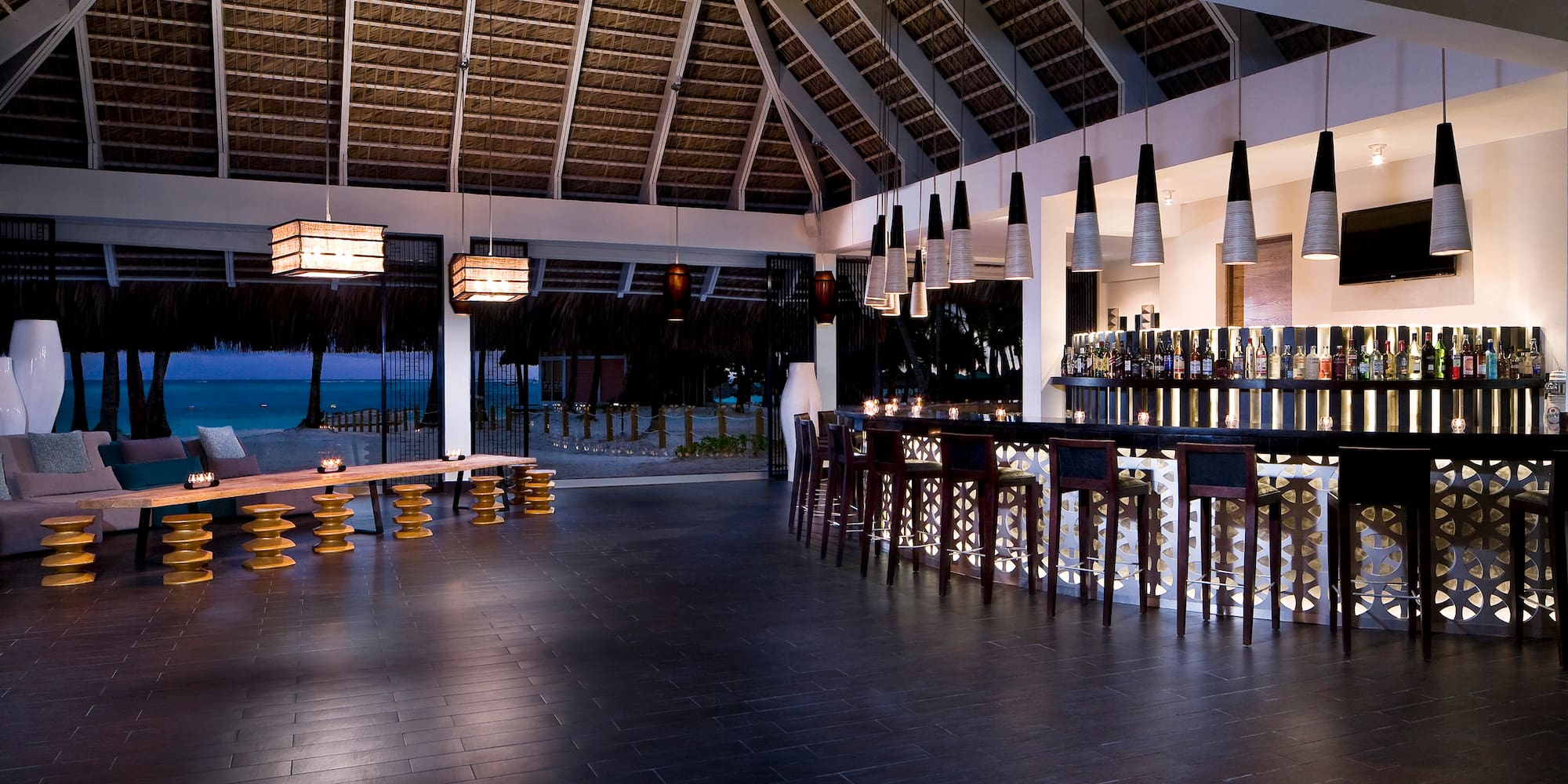 a bar with a long counter and a long bench