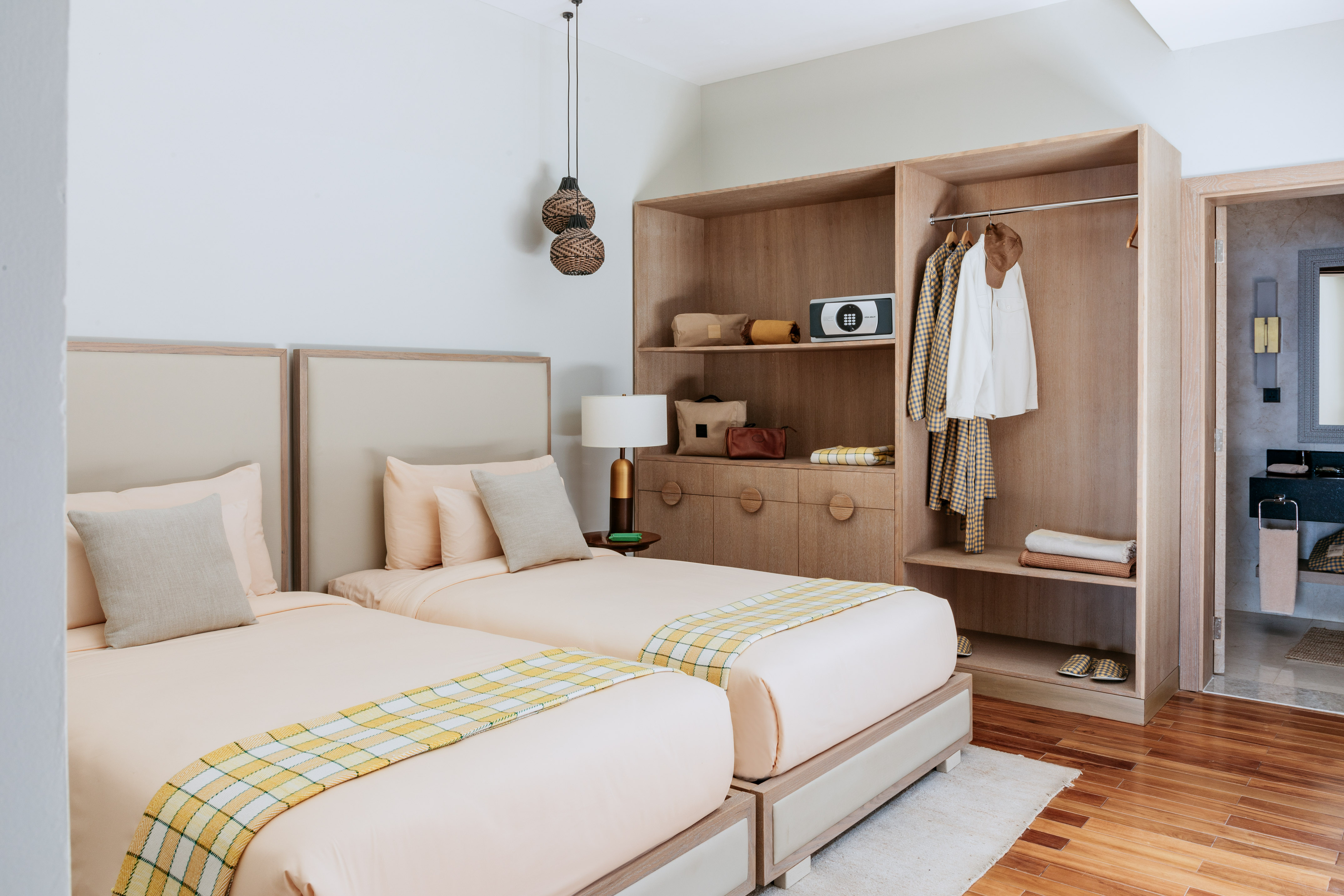 a room with two beds and a closet