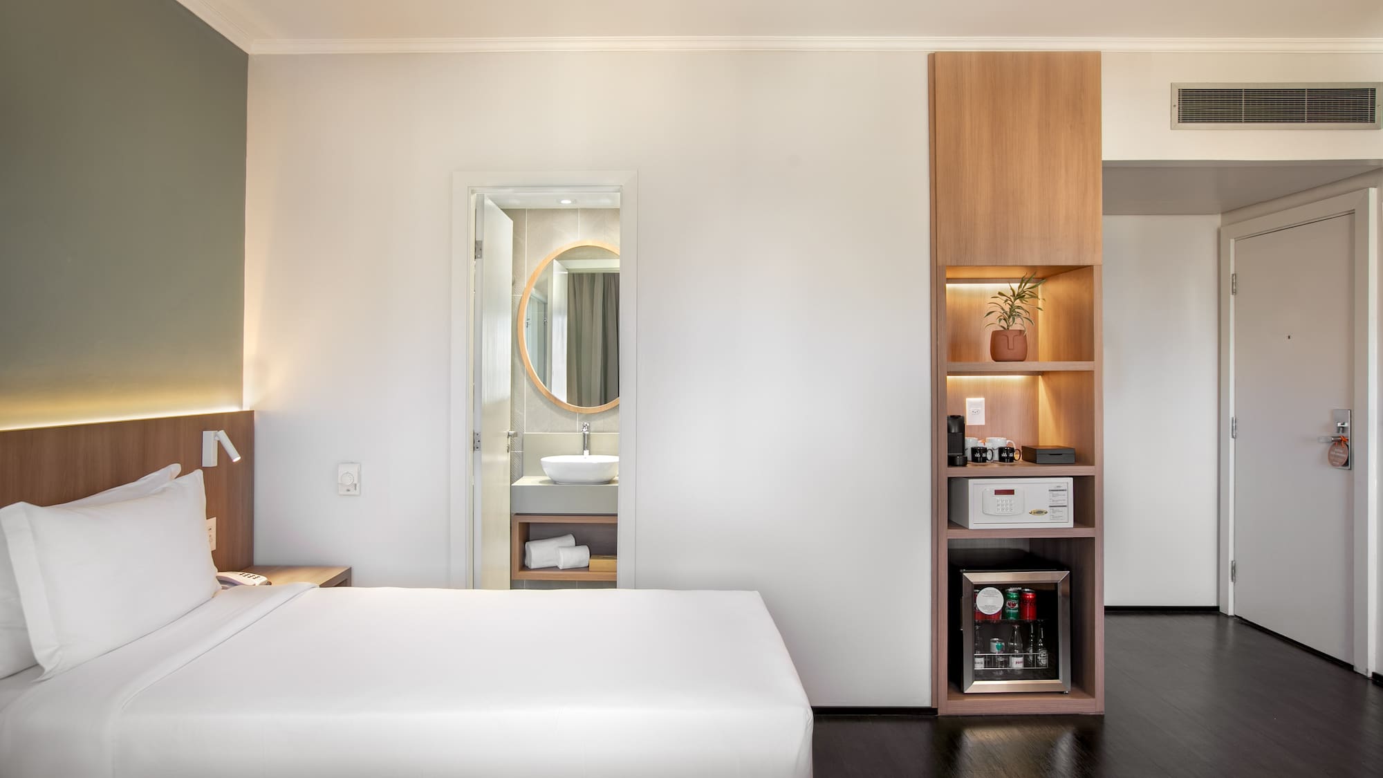 a room with a bed and a shelf