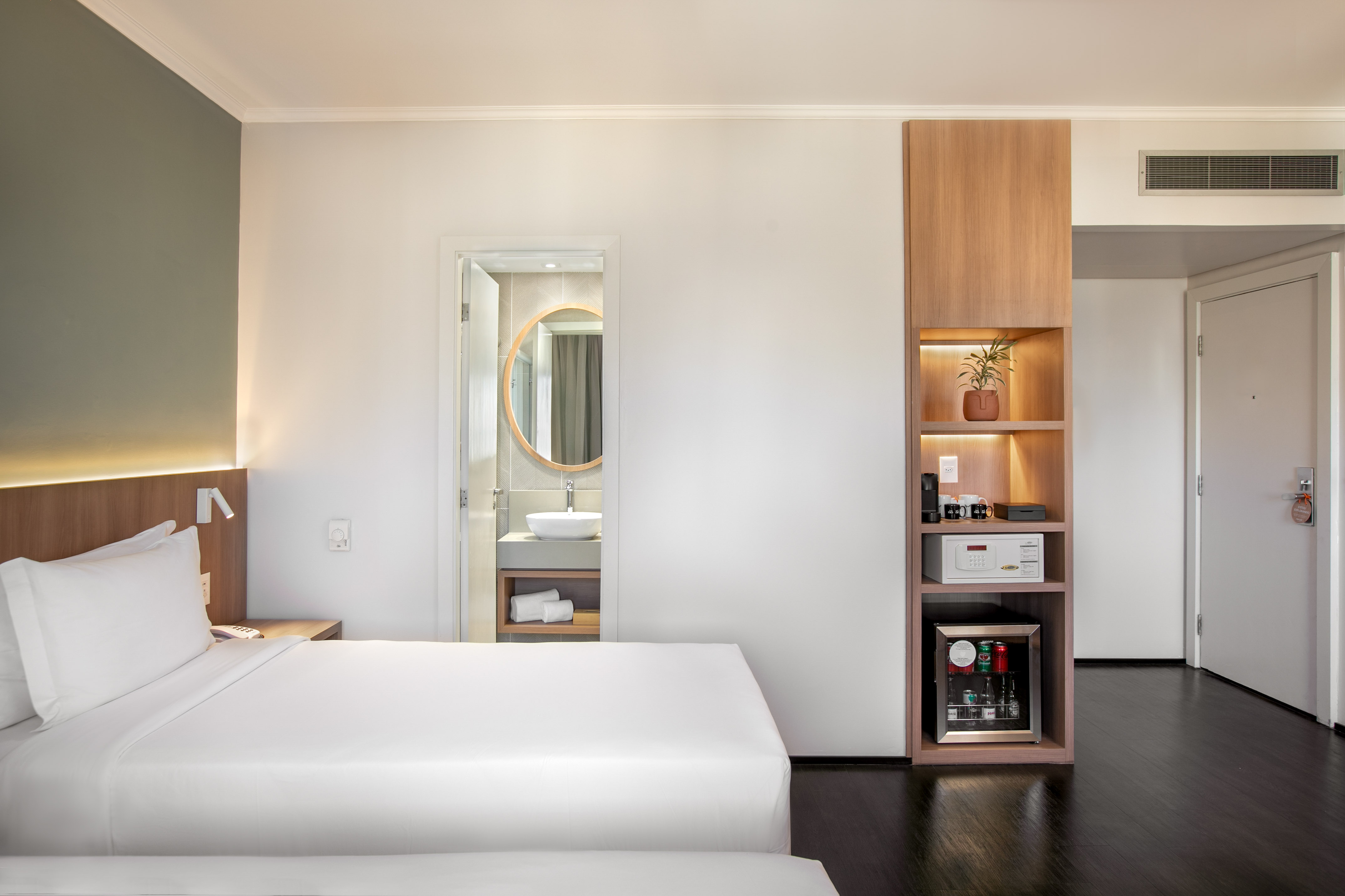 a room with a bed and a shelf
