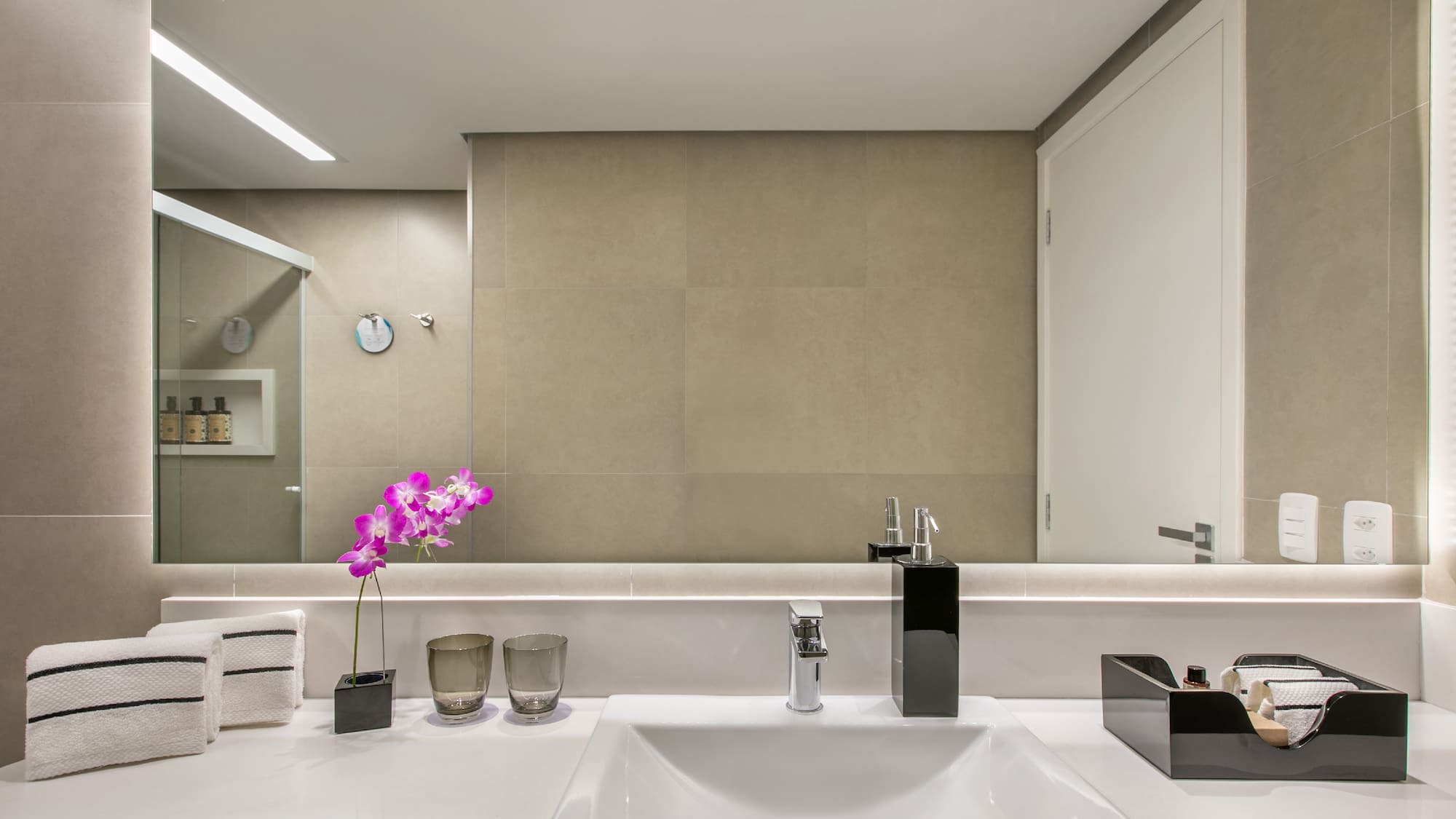 a bathroom with a sink and a mirror