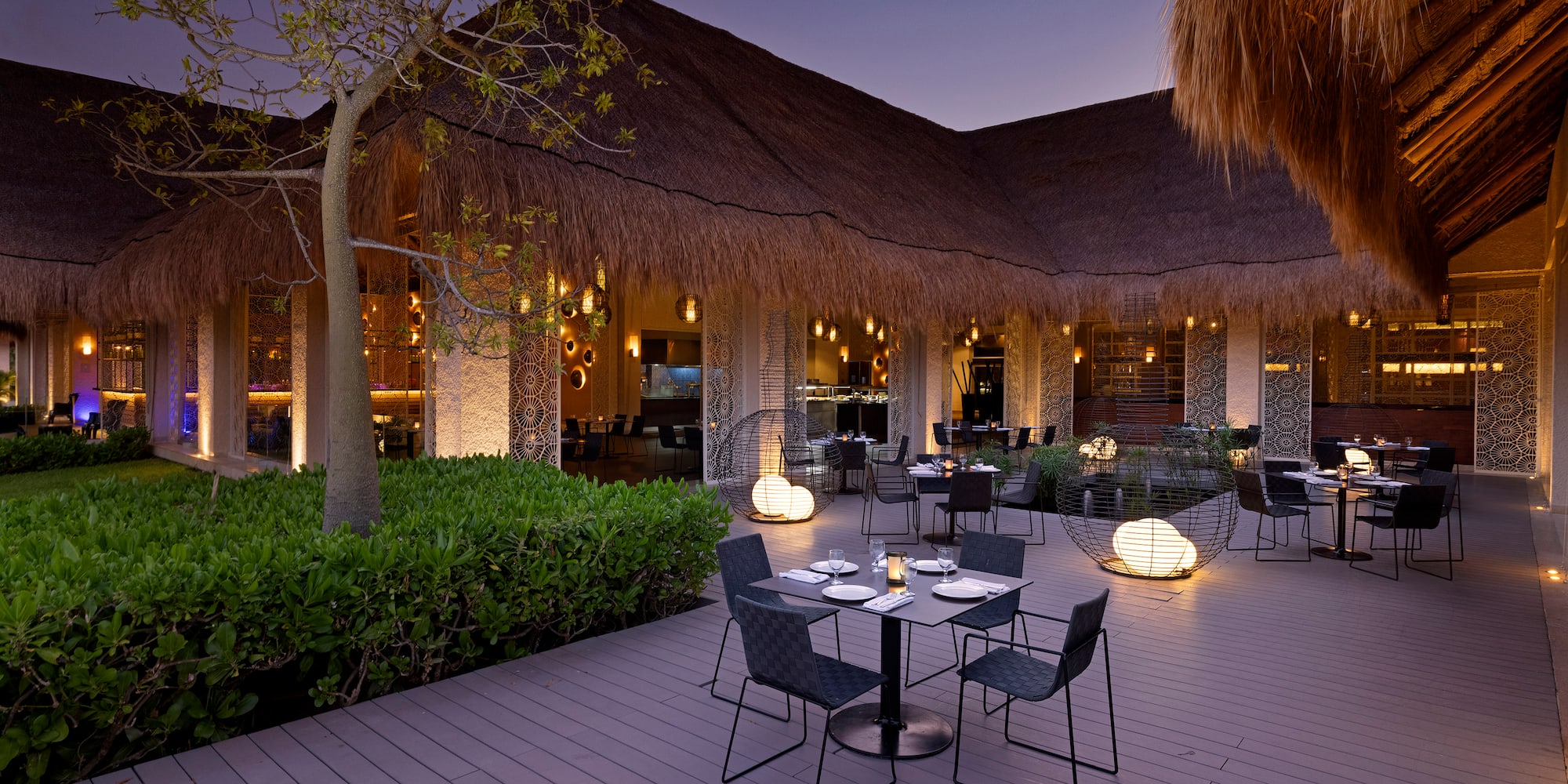a restaurant with tables and chairs on a deck