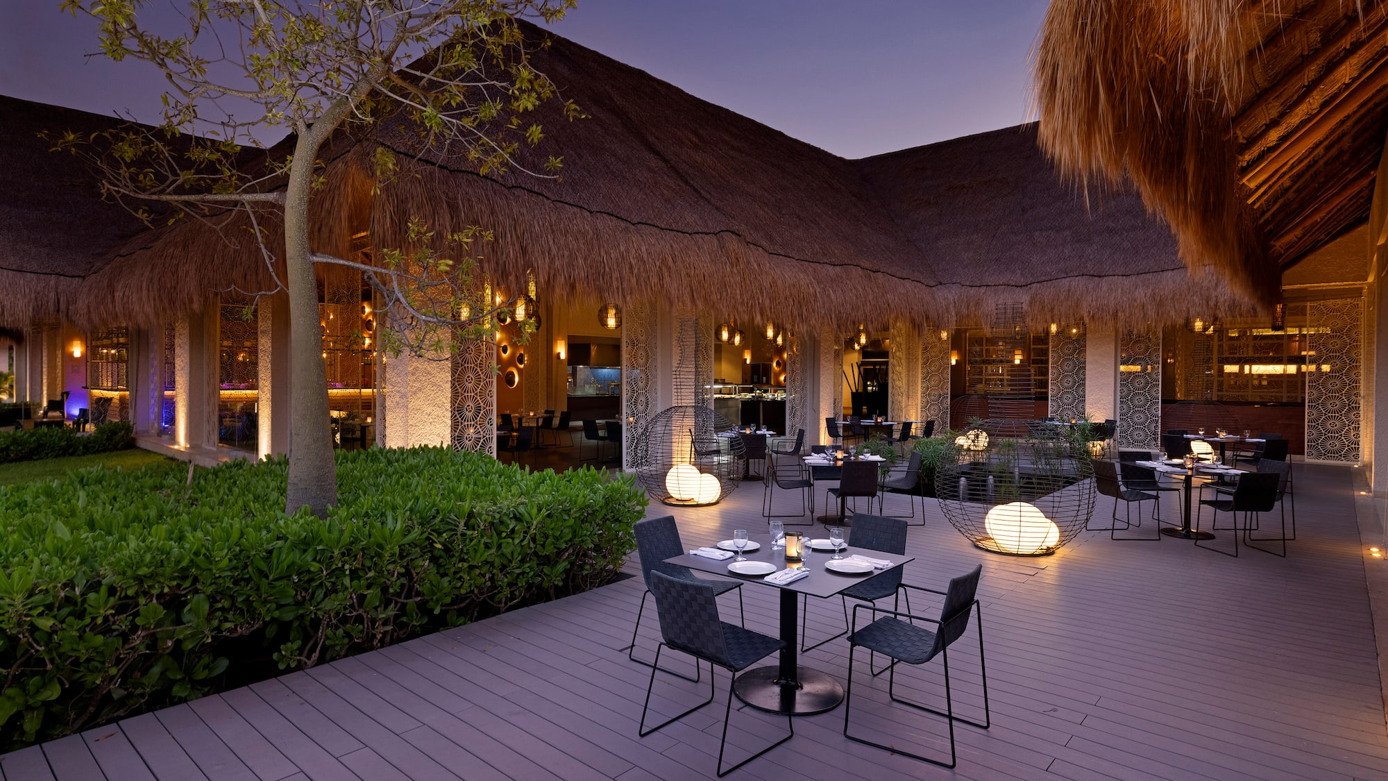 a restaurant with tables and chairs on a deck