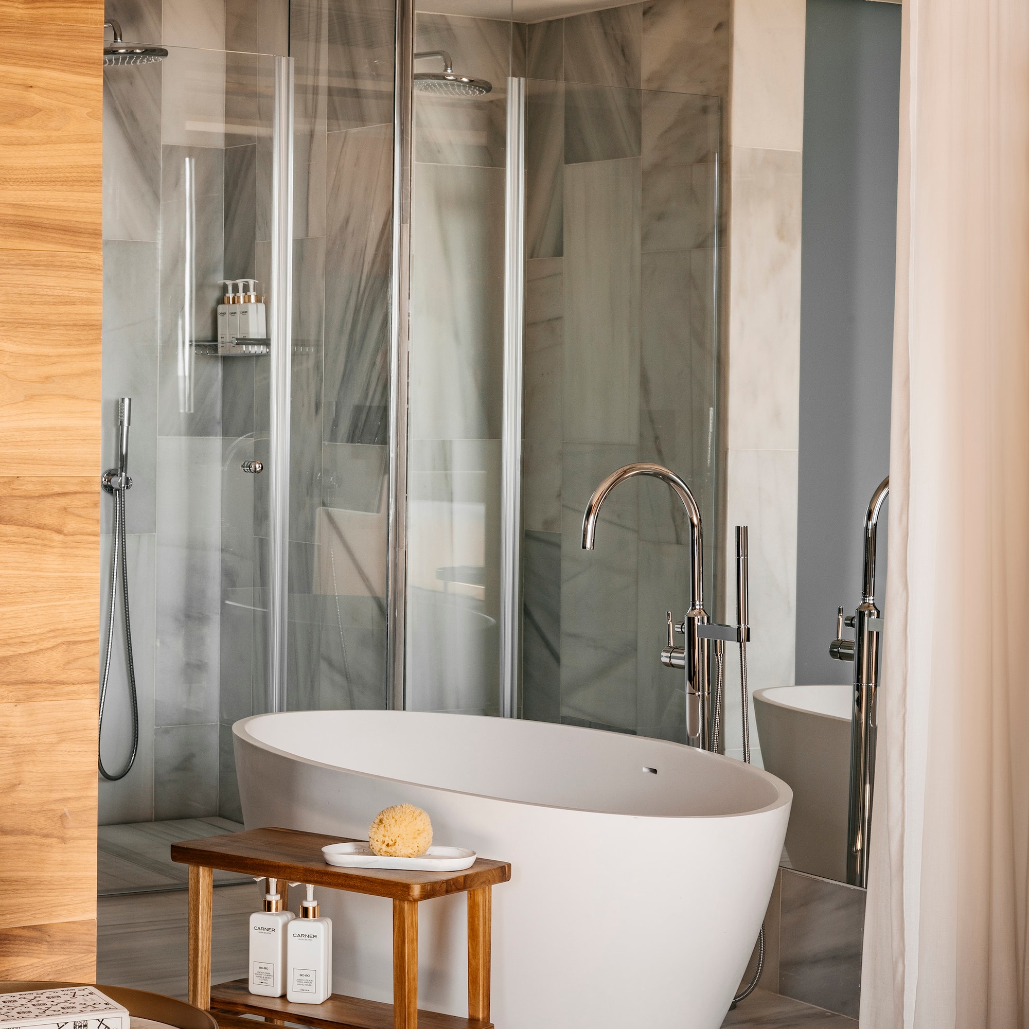 a bathroom with a tub and shower