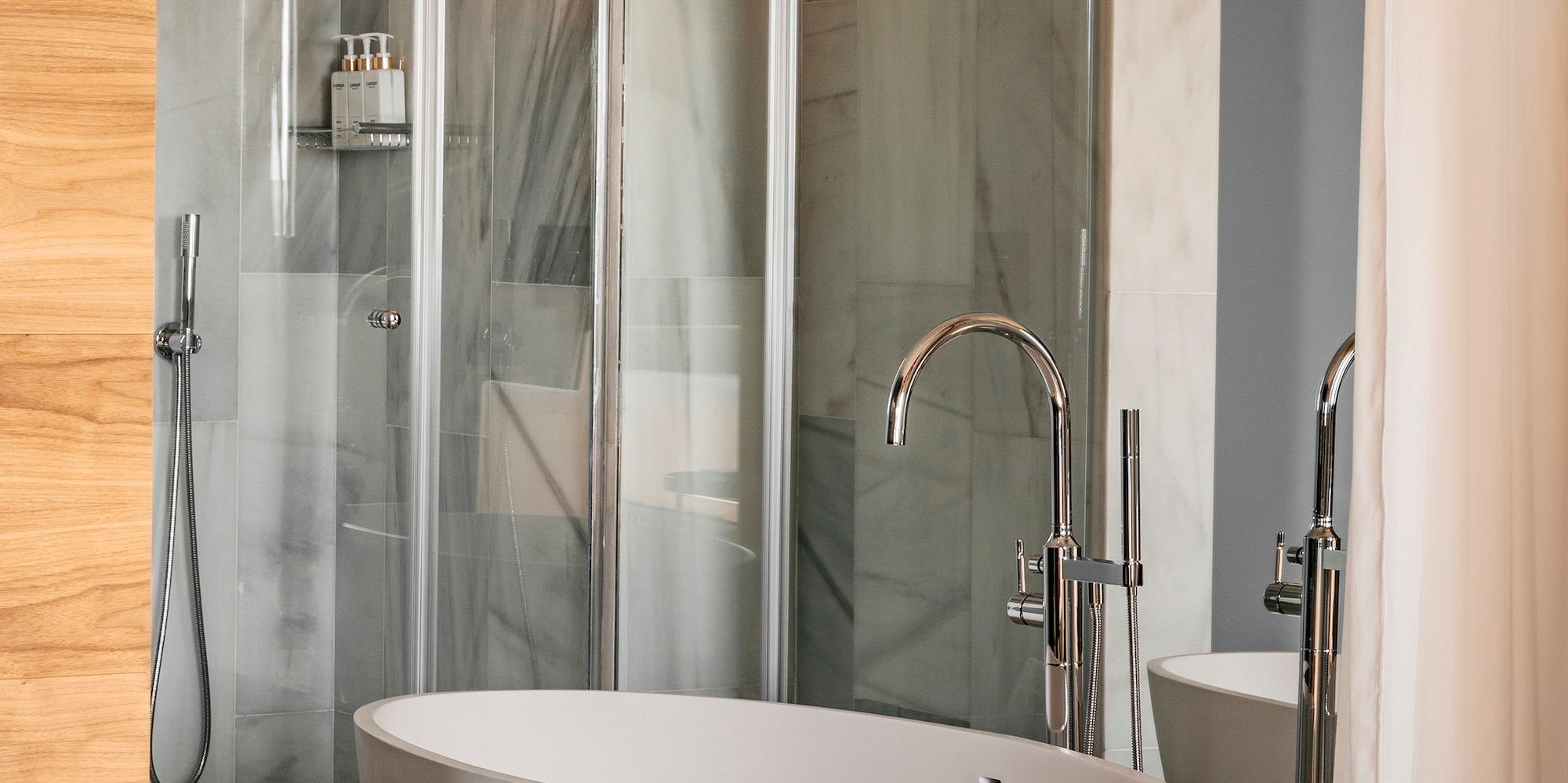 a bathroom with a tub and shower