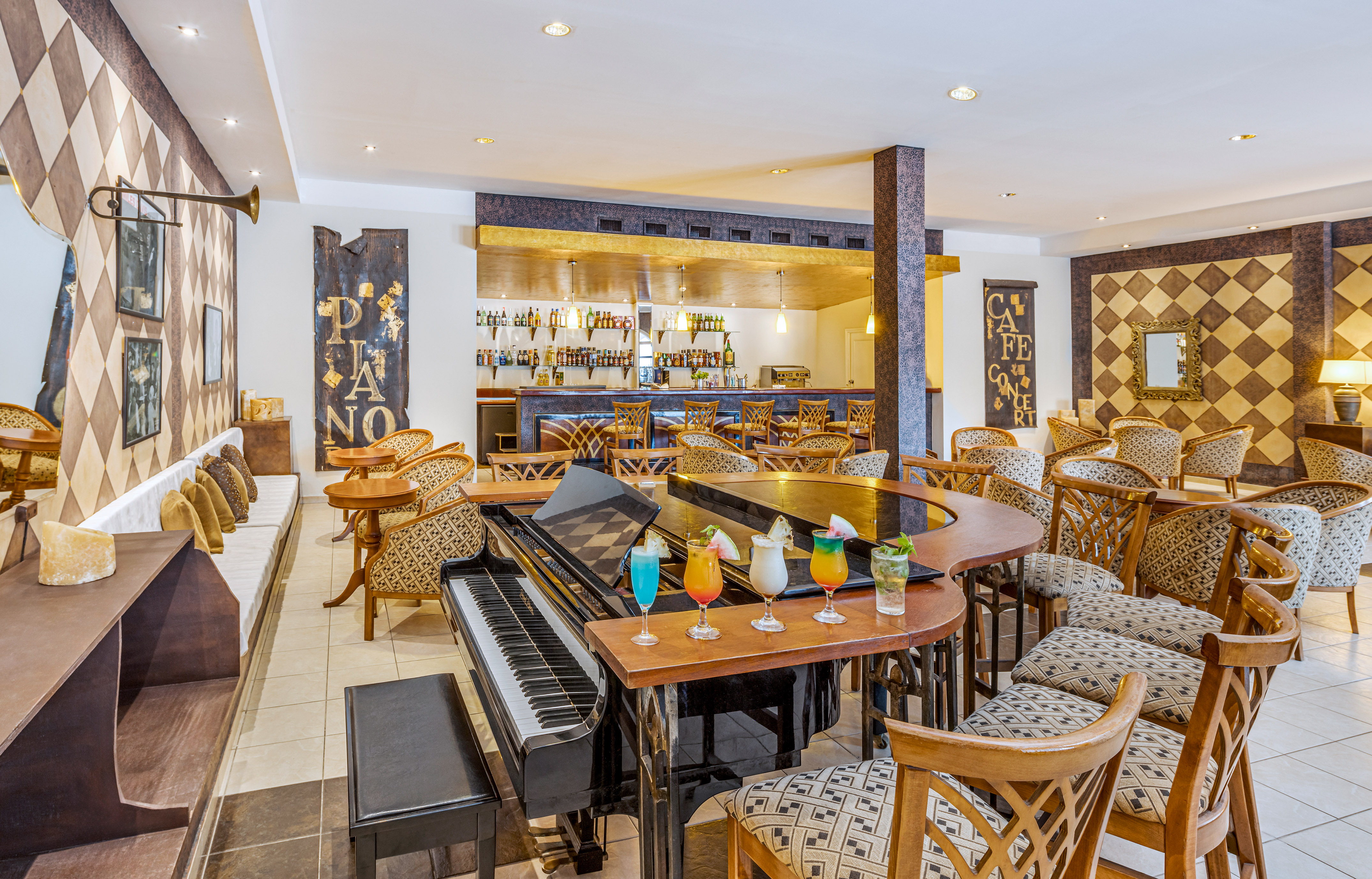 a bar with a piano and chairs