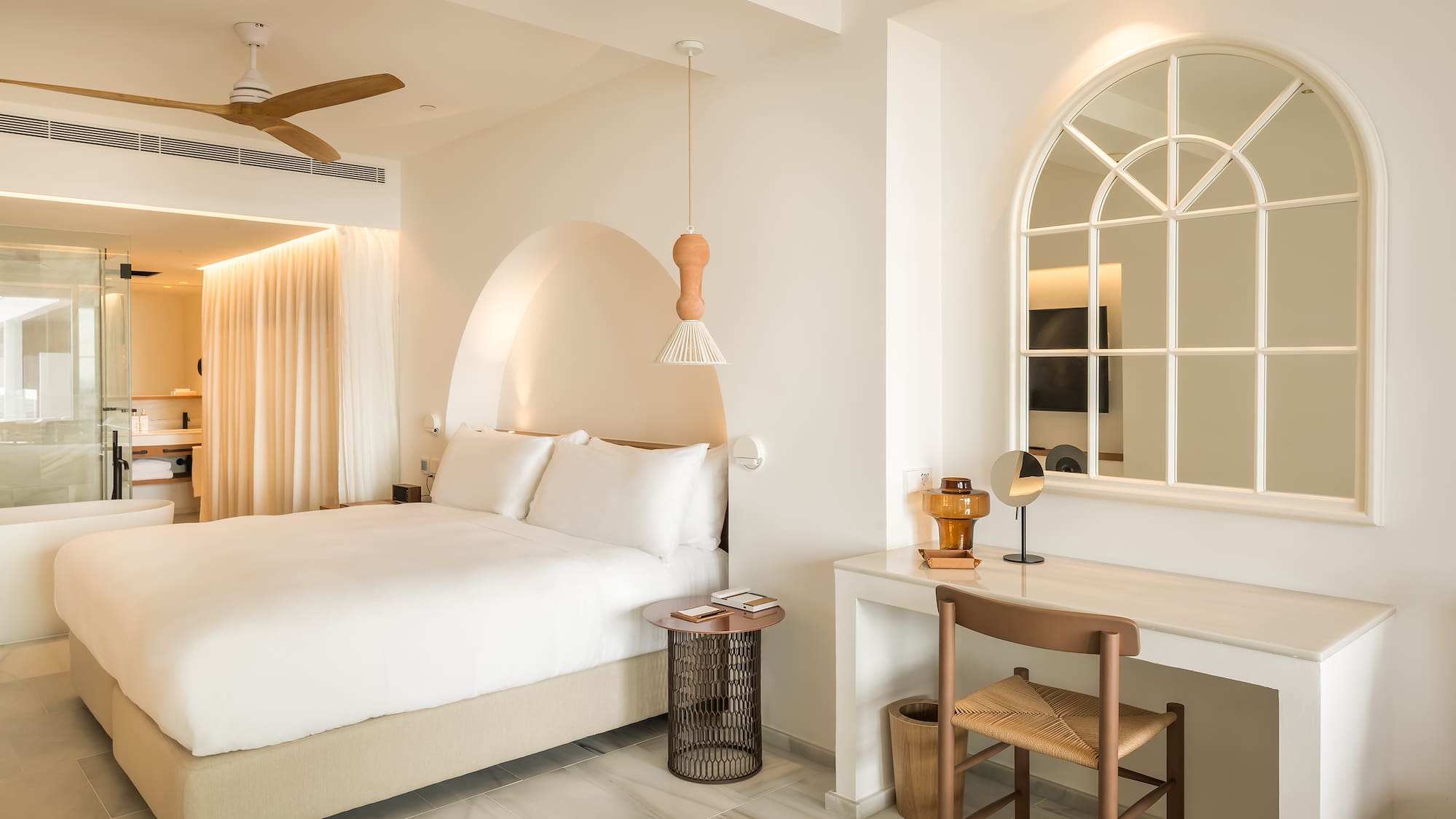 a bedroom with a bed and a desk