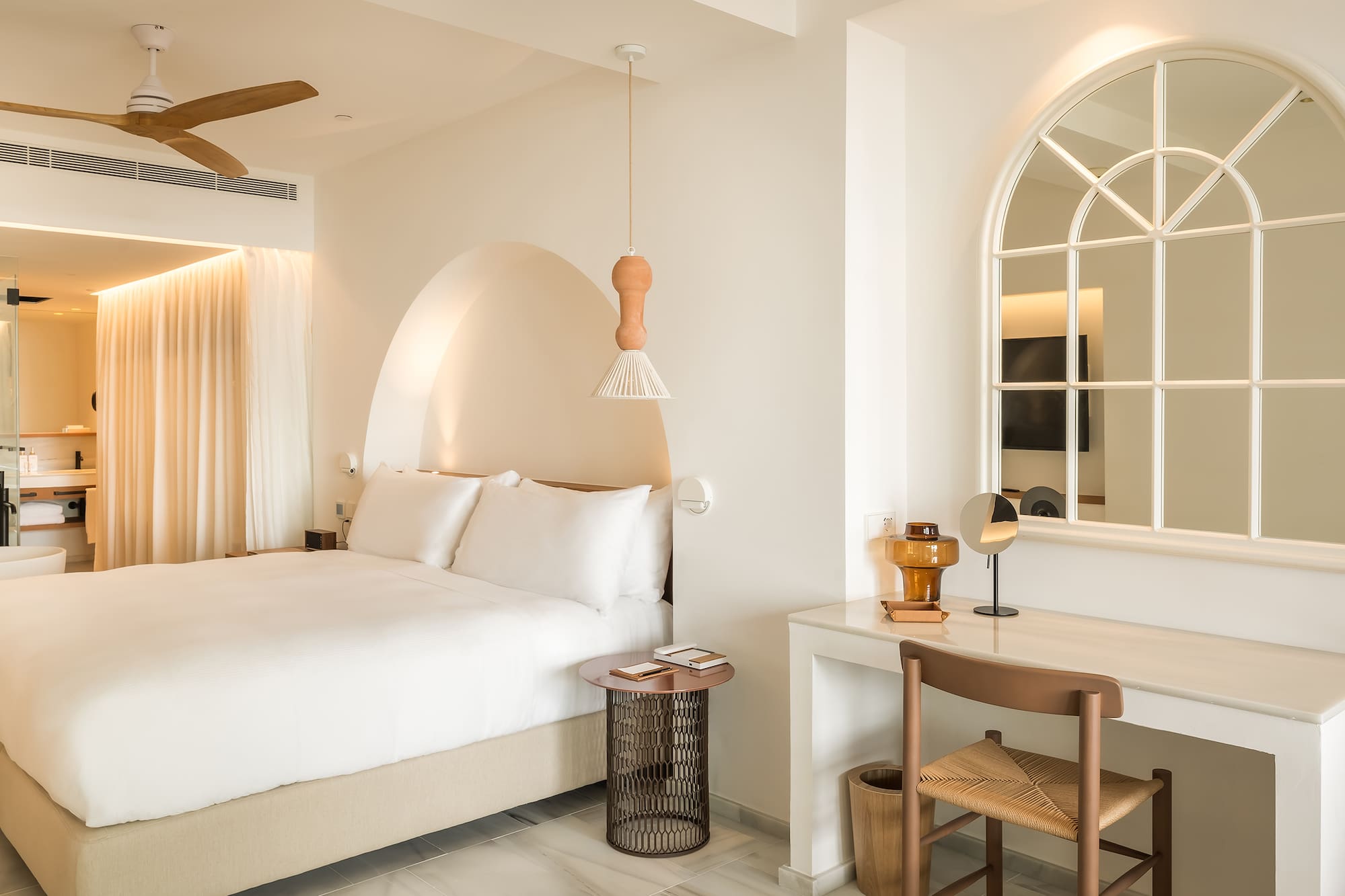 a bedroom with a bed and a desk