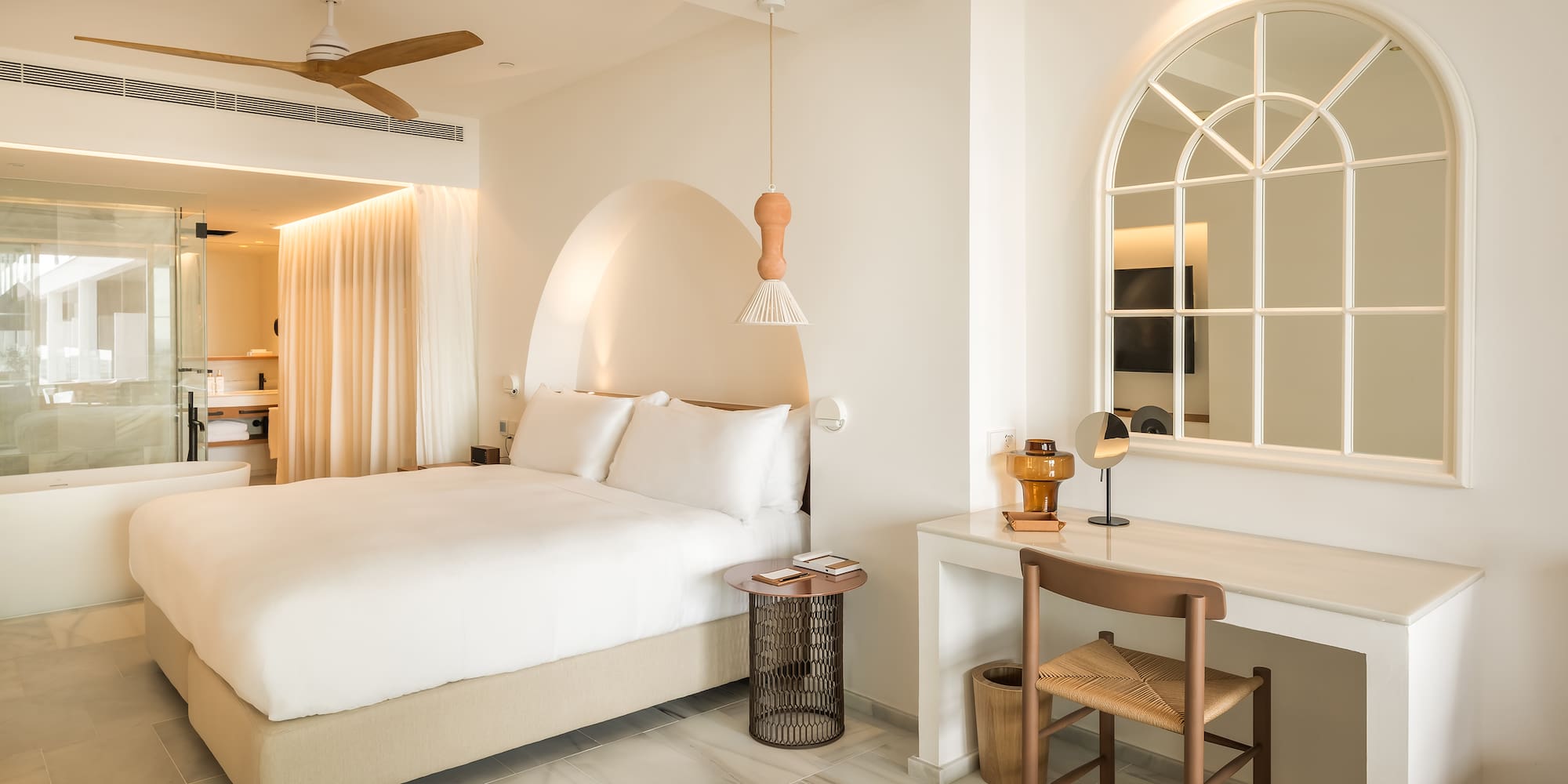 a bedroom with a bed and a desk