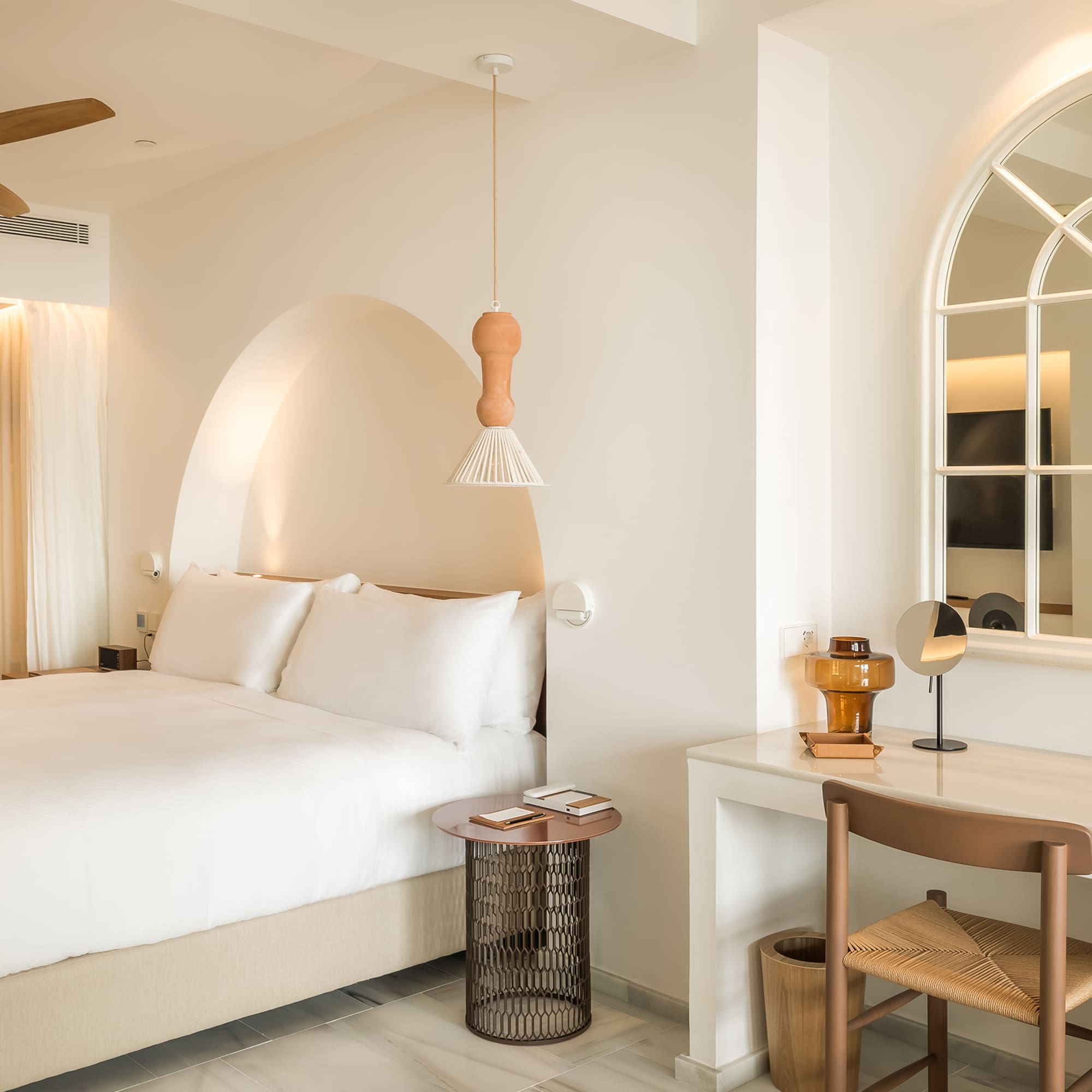 a bedroom with a bed and a desk