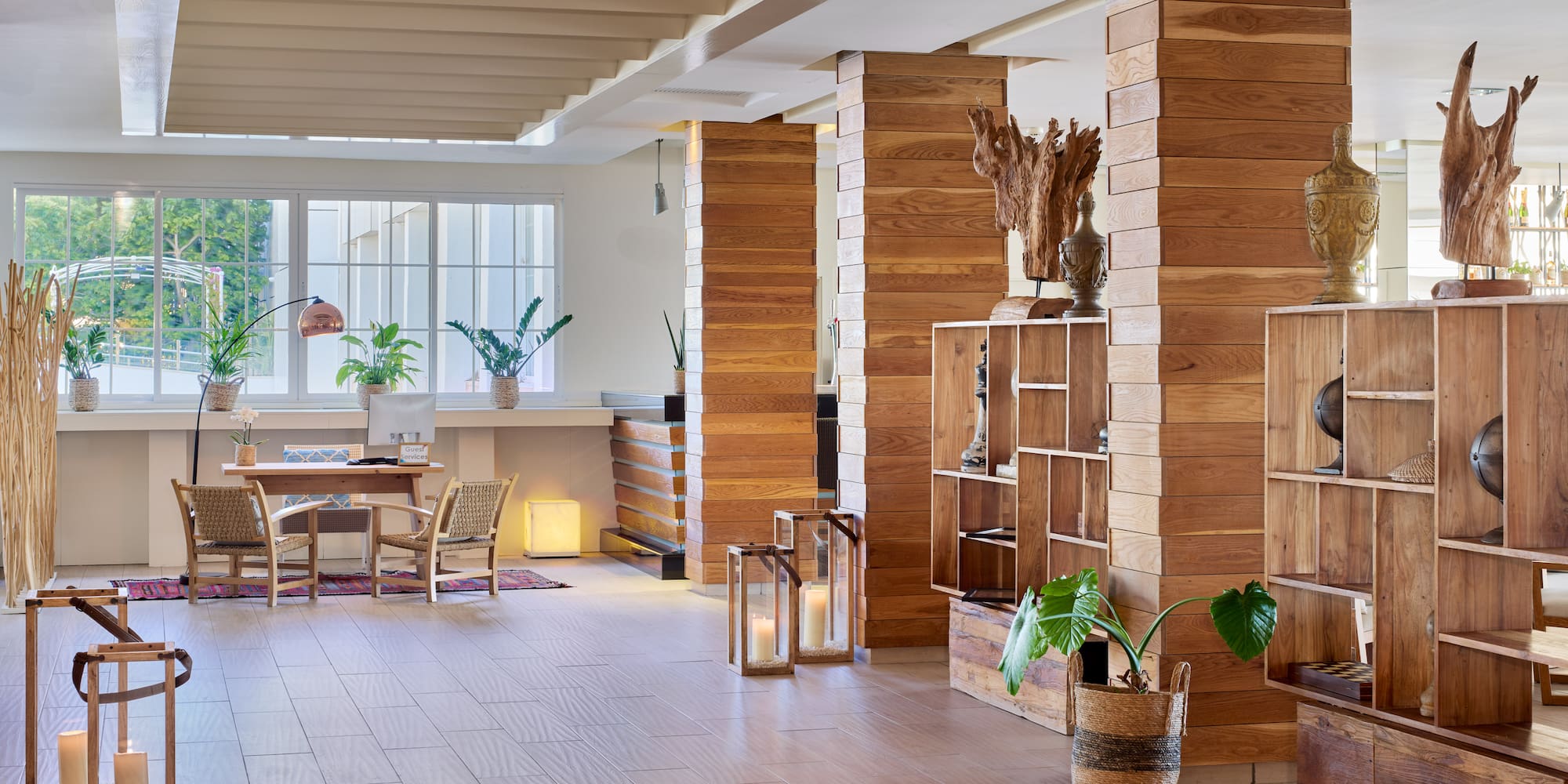 a room with wood columns and a table and chairs