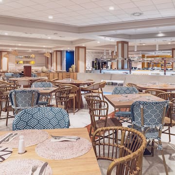 a restaurant with tables and chairs