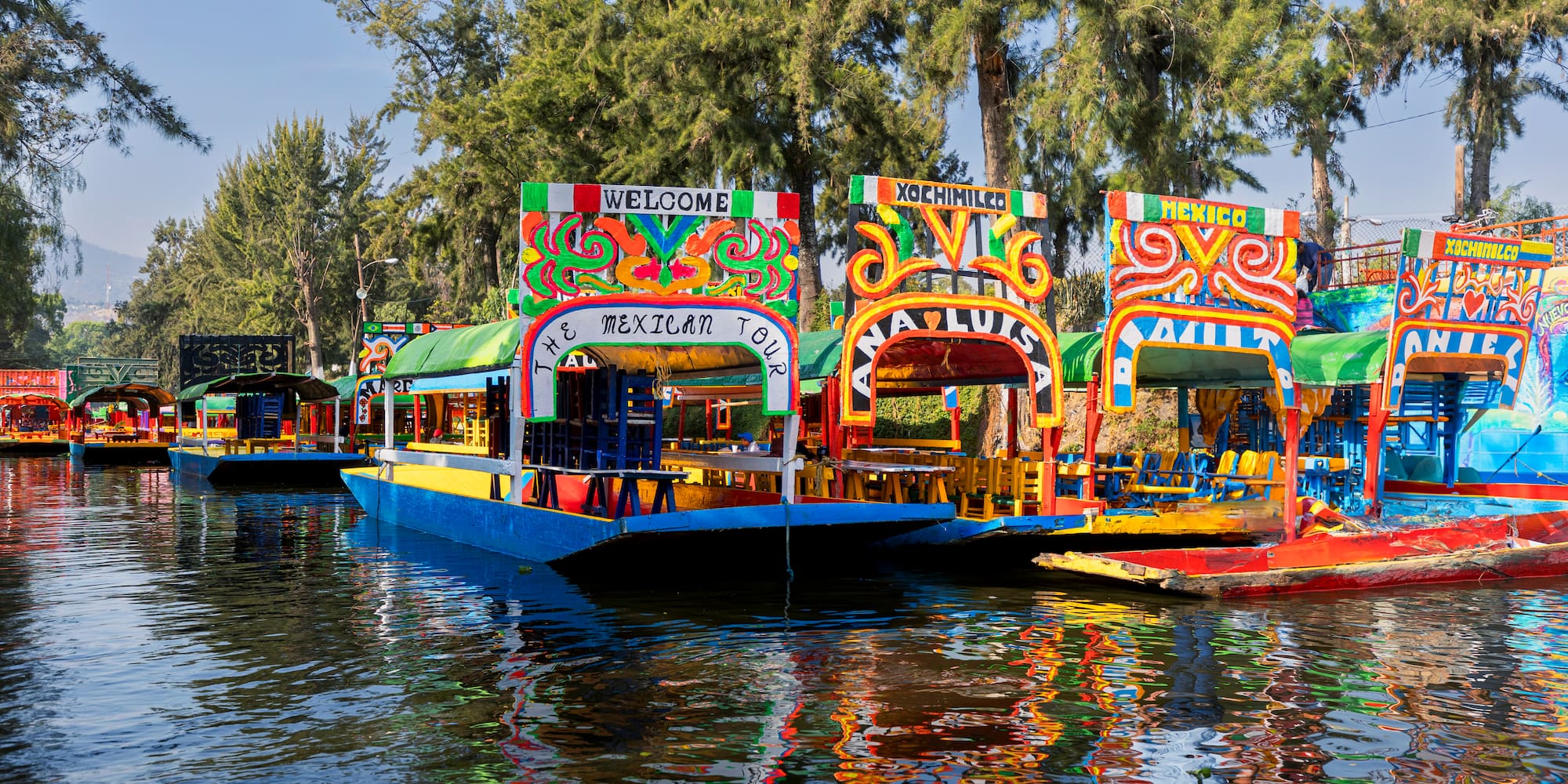 Vibrant Xochimilco trajineras on canals in Mexico City.