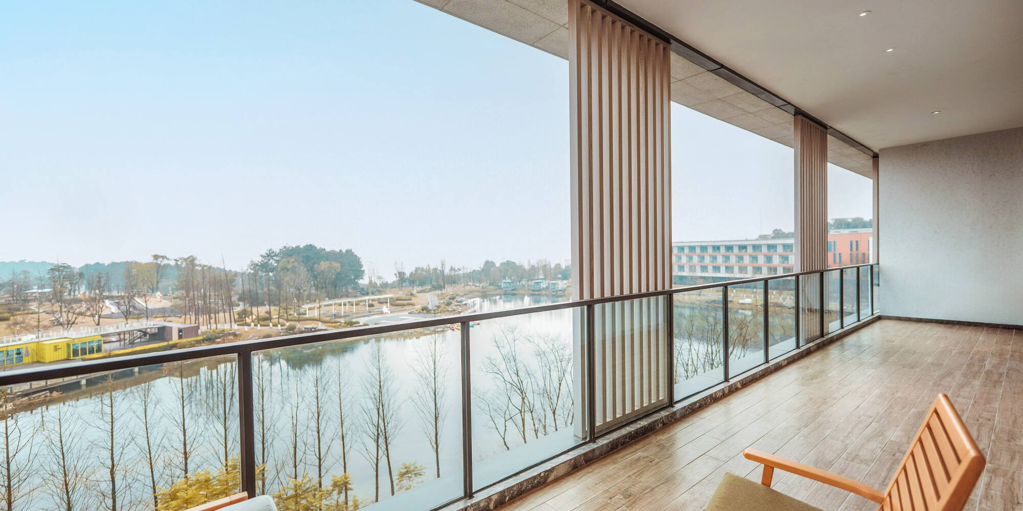 a balcony with a view of a river and a city