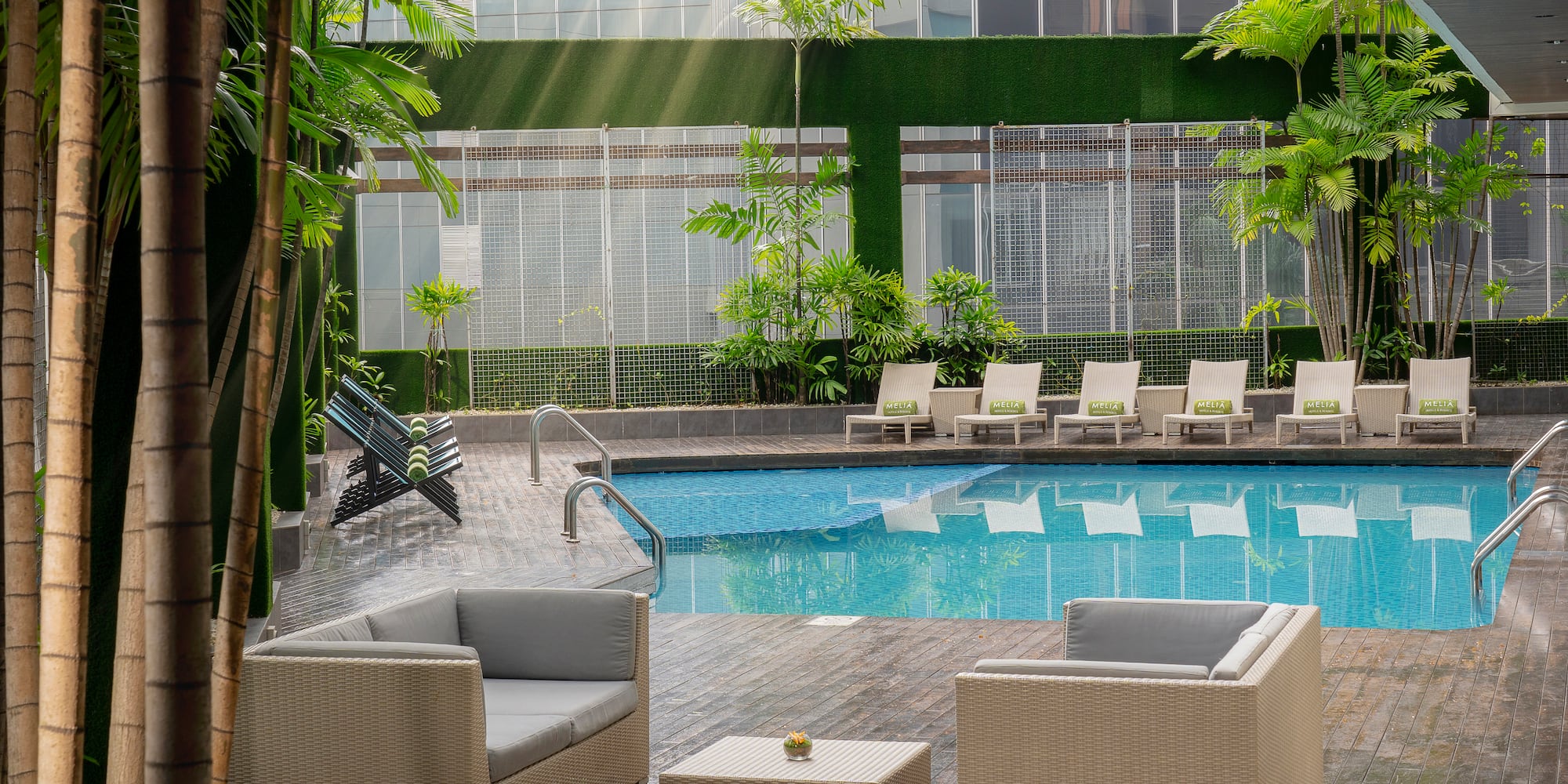 a pool with chairs and a table