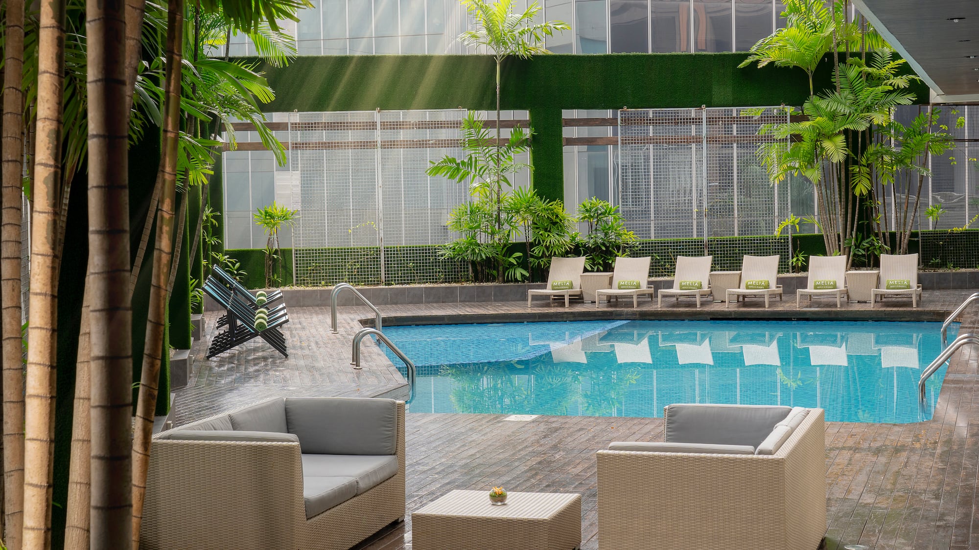 a pool with chairs and a table