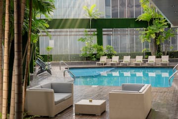 a pool with chairs and a table