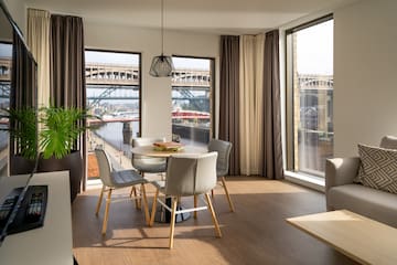 a room with a table and chairs