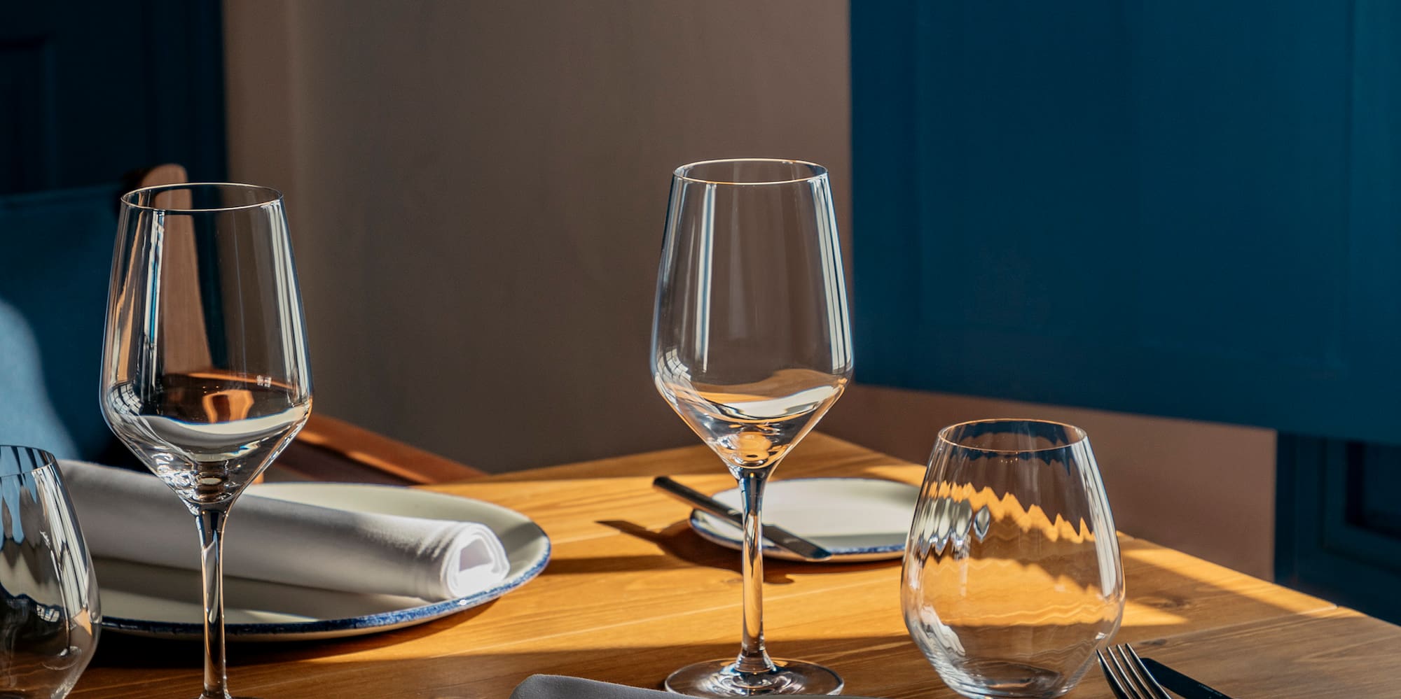 a table with plates and glasses