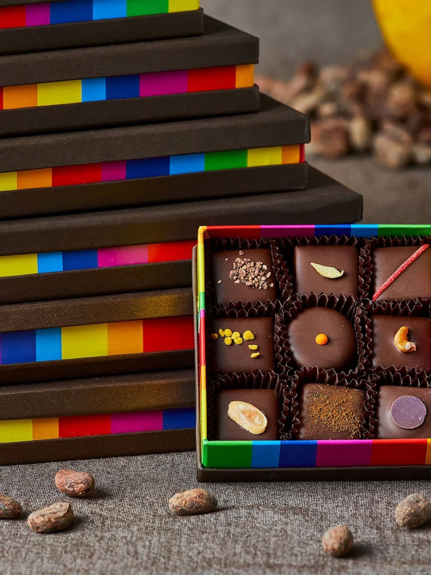 a box of chocolates next to a stack of boxes