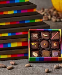 a box of chocolates next to a stack of boxes