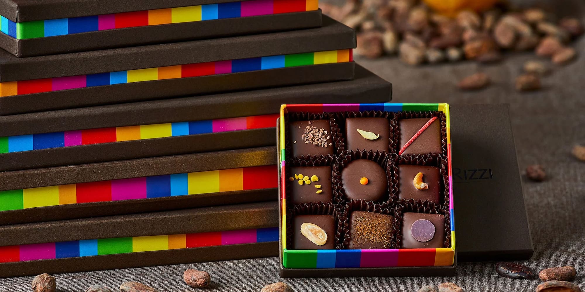 a box of chocolates next to a stack of boxes