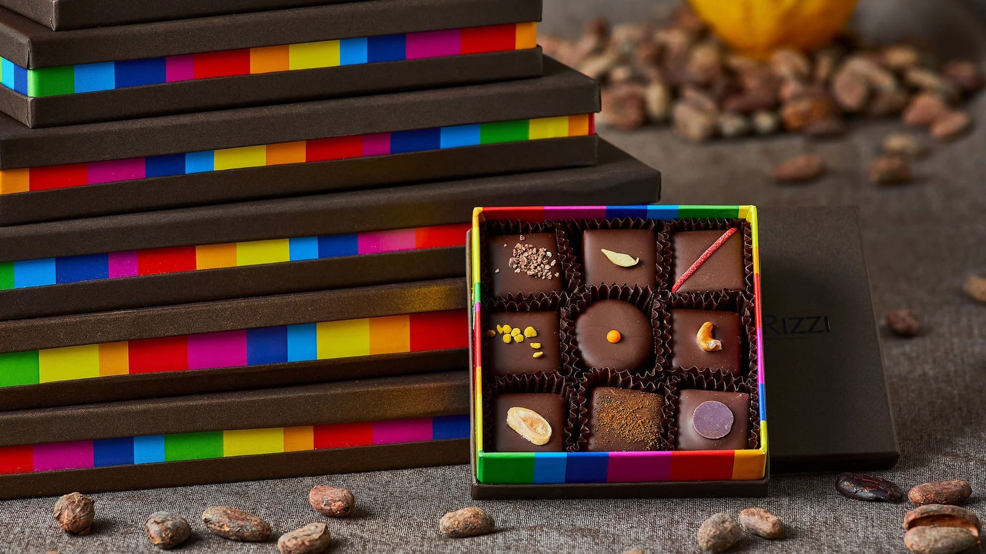 a box of chocolates next to a stack of boxes