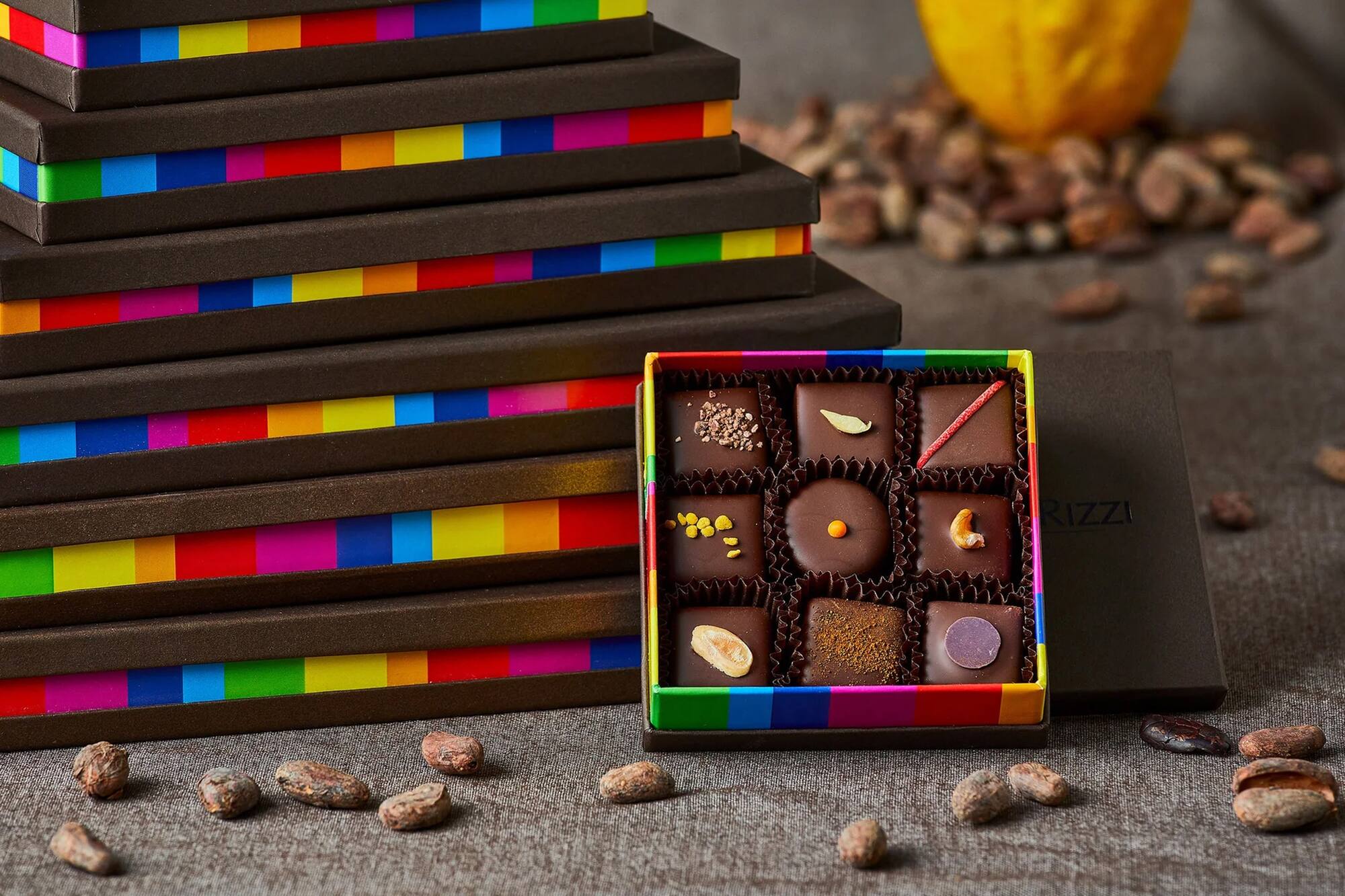 a box of chocolates next to a stack of boxes