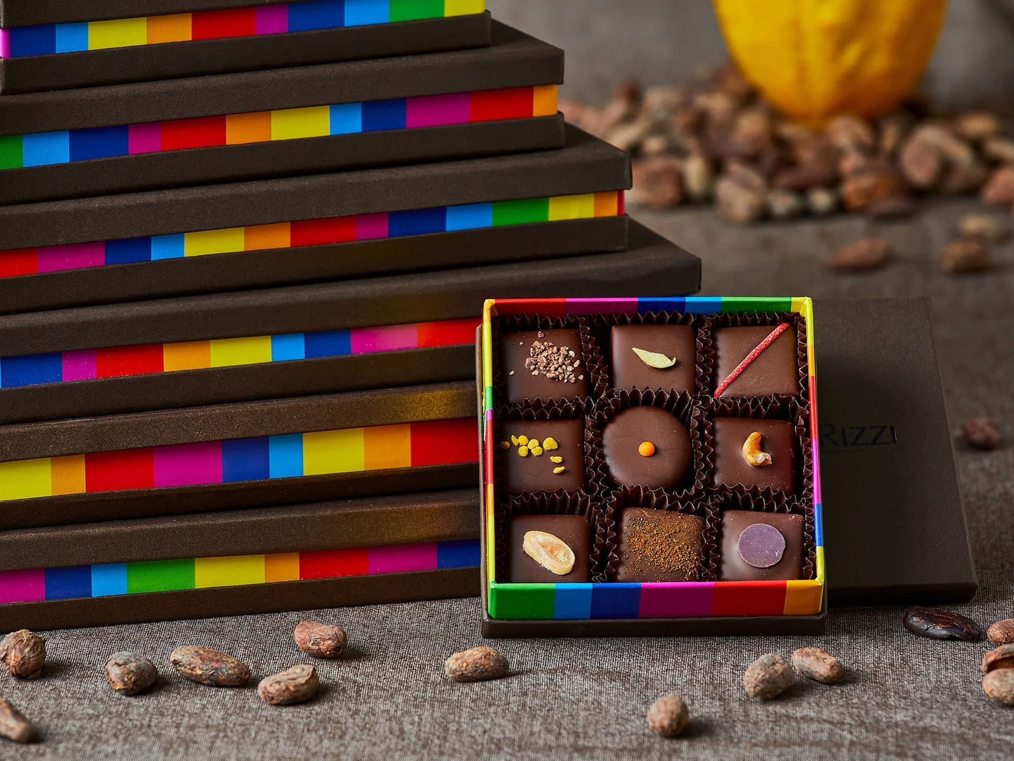 a box of chocolates next to a stack of boxes