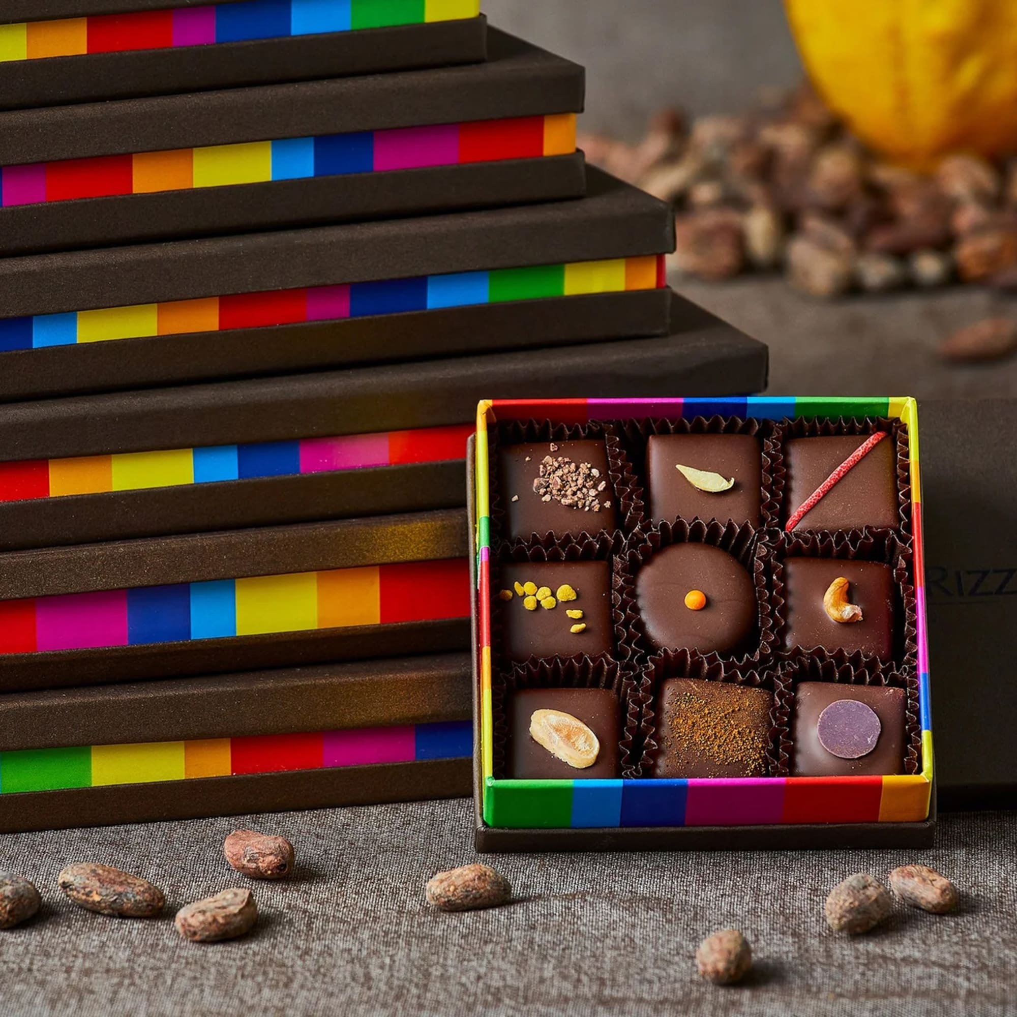 a box of chocolates next to a stack of boxes